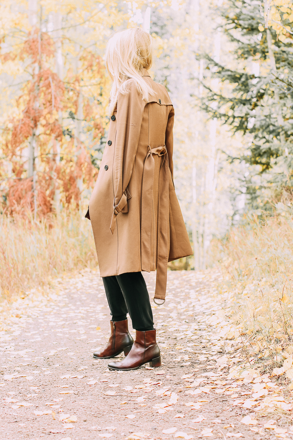 ankle boots for walking in Bison brown with low block heel and comfort, cushion technology by ECCO on fashion blogger in black joggers by Norma Kamali and black off shoulder top with brown crossbody bag