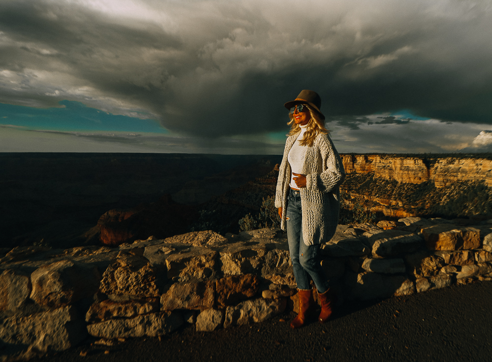 Grand Canyon Rim Trail featuring fashion blogger Erin Busbee of BusbeeStyle.com wearing camel culottes, white turtleneck and a brown hat