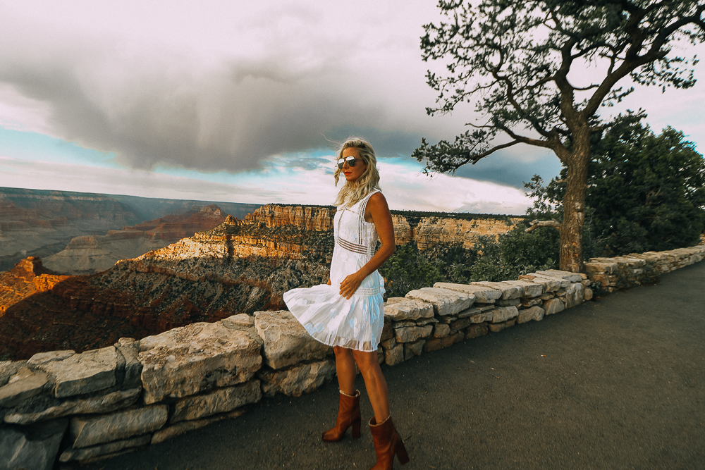 Wearing White After Labor Day blonde woman wearing a white lace dress with brown booties visiting the grand canyon