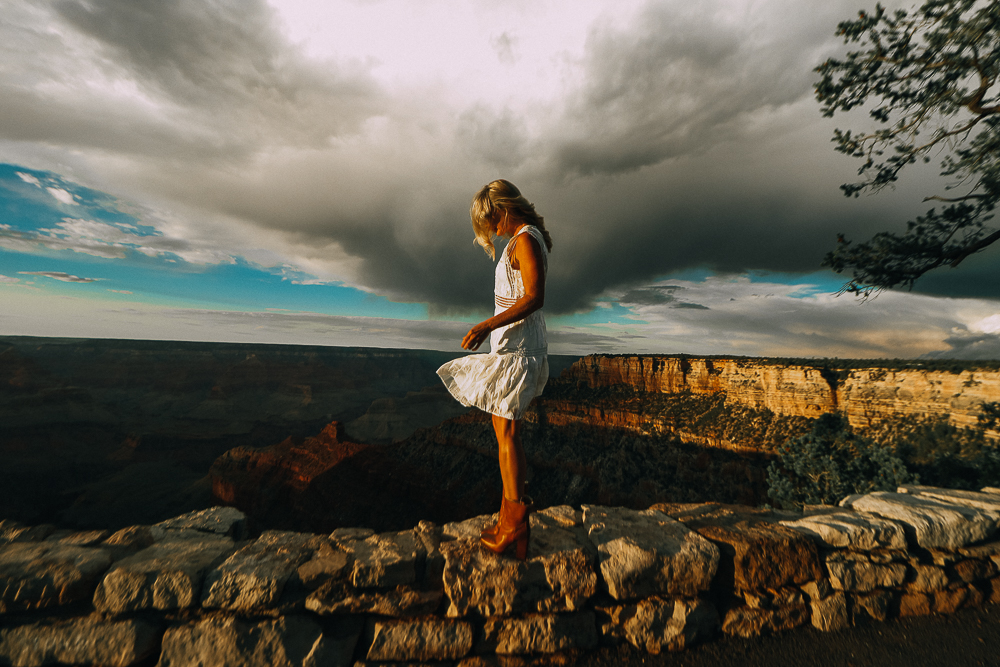 Wearing White After Labor Day blonde woman wearing a white lace dress with brown booties visiting the grand canyon