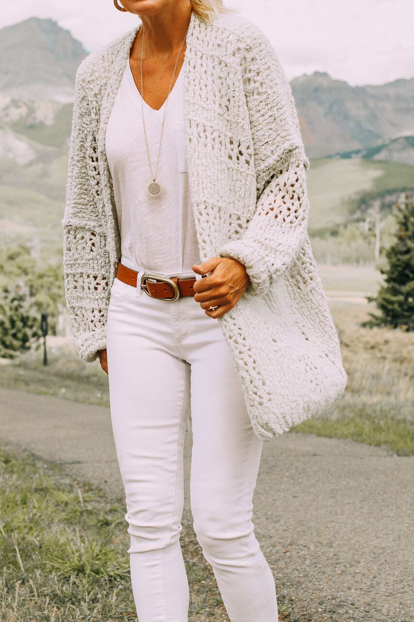 wear white after labor day with this white free people chunky cardigan, white skinny jeams, and madewell tee, worn by blonde woman in telluride, colorado