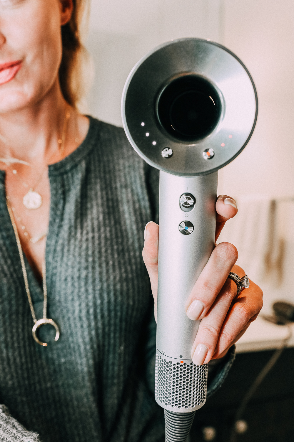 Best Selling Gifts QVC featuring the Dyson hair dryer in white and silver