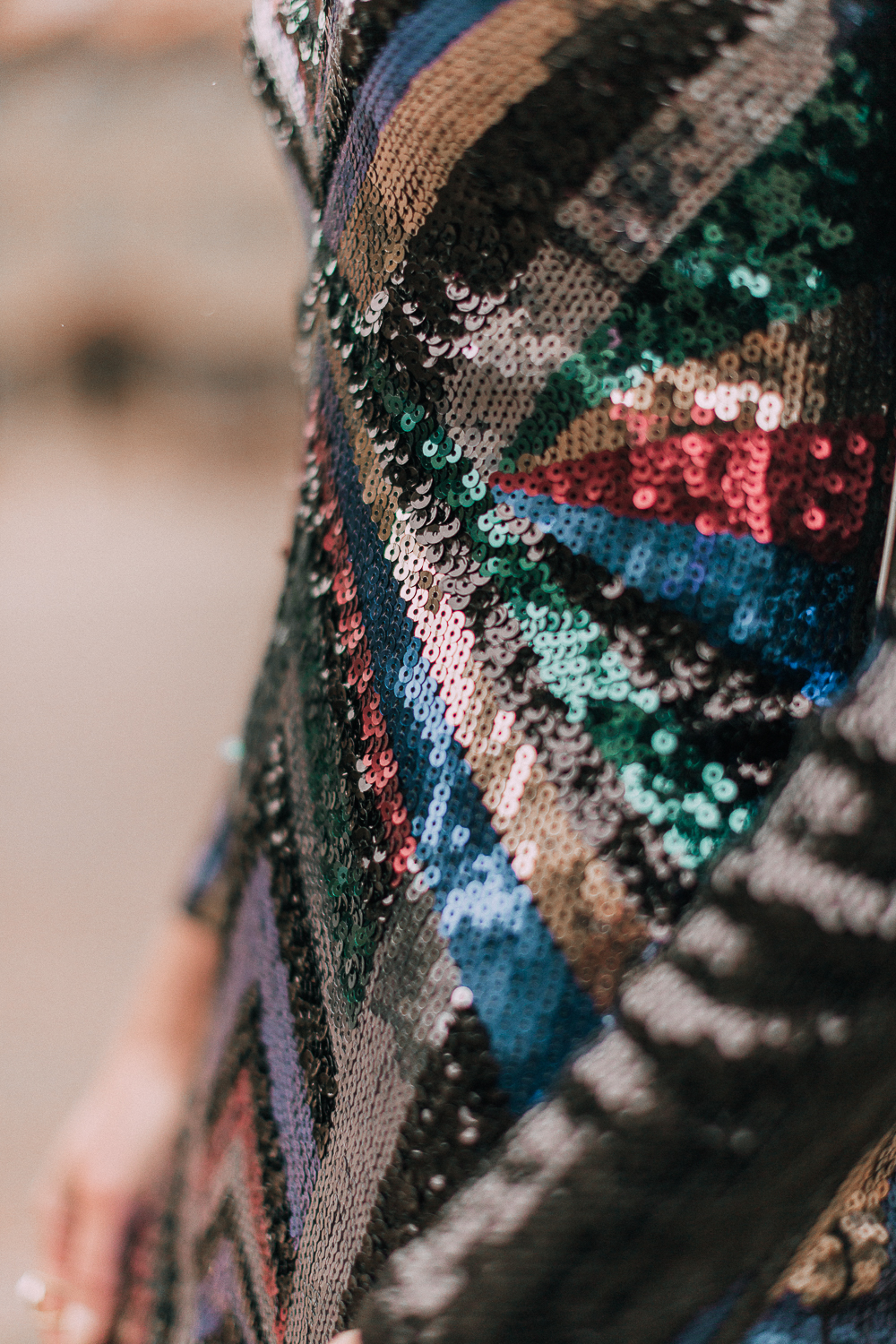 Unexpected holiday party outfits featuring a long-sleeve, colorful sequin mini dress from Express on blonde fashion blogger in the snow in Telluride, Colorado