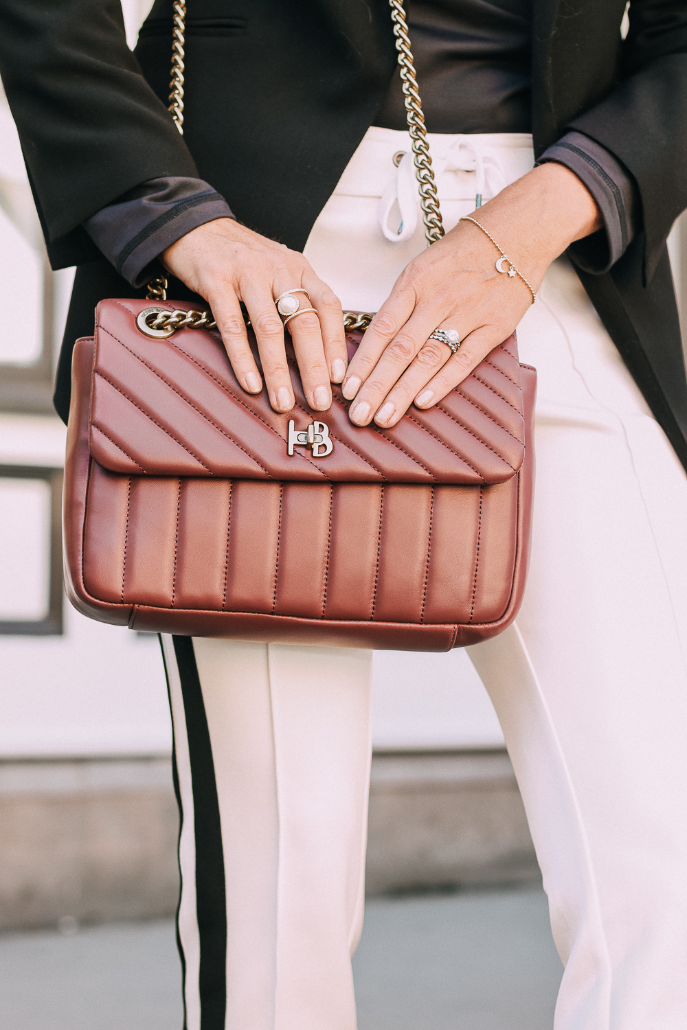 Henri Bendel quilted crossbody bag in burgundy with gold chain link detail