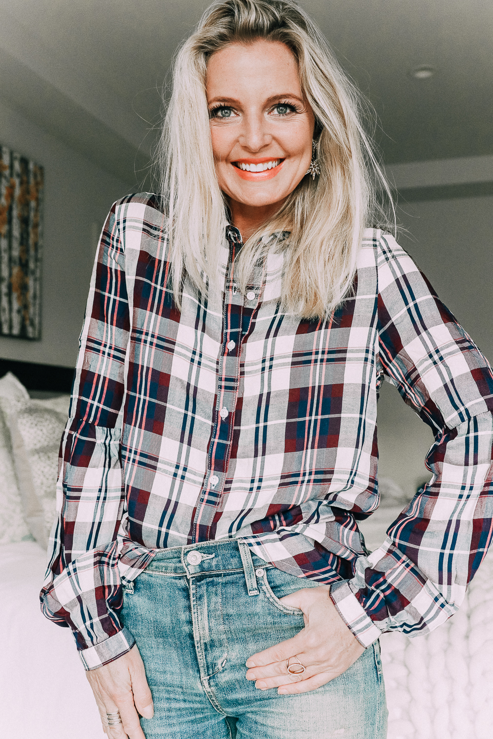 Blonde woman wearing a plaid shirt with bubble sleeves from Walmart with jeans sharing updating your fall wardrobe under $50