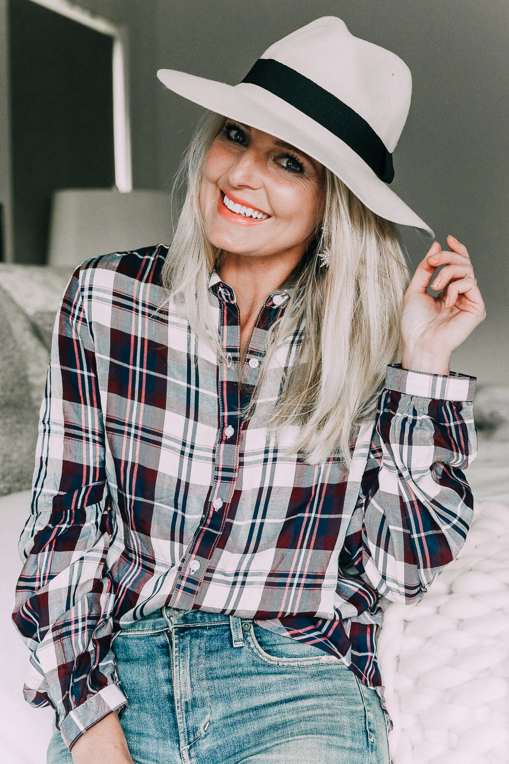 Blonde woman wearing a plaid shirt with bubble sleeves from Walmart with jeans sharing updating your fall wardrobe under $50