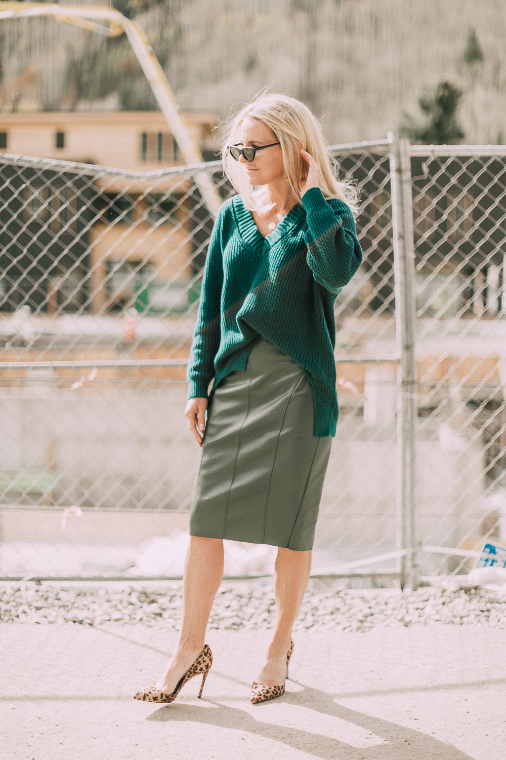 what to wear to work green leather skirt green sweater fall office outfit idea meghan markle inspiration