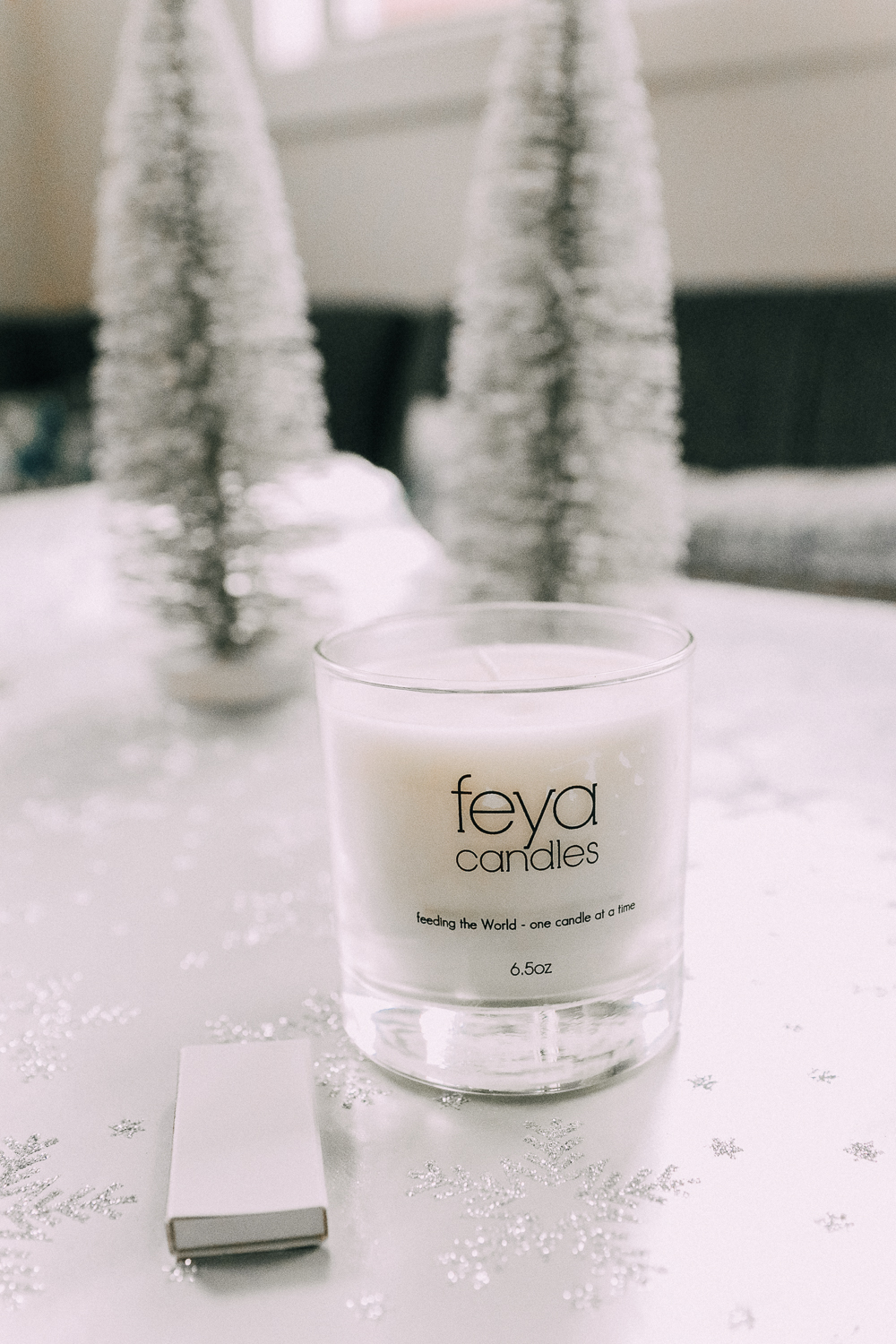 holiday gifts from JCPenney featuring a Feya holiday cheer boxed soy candle