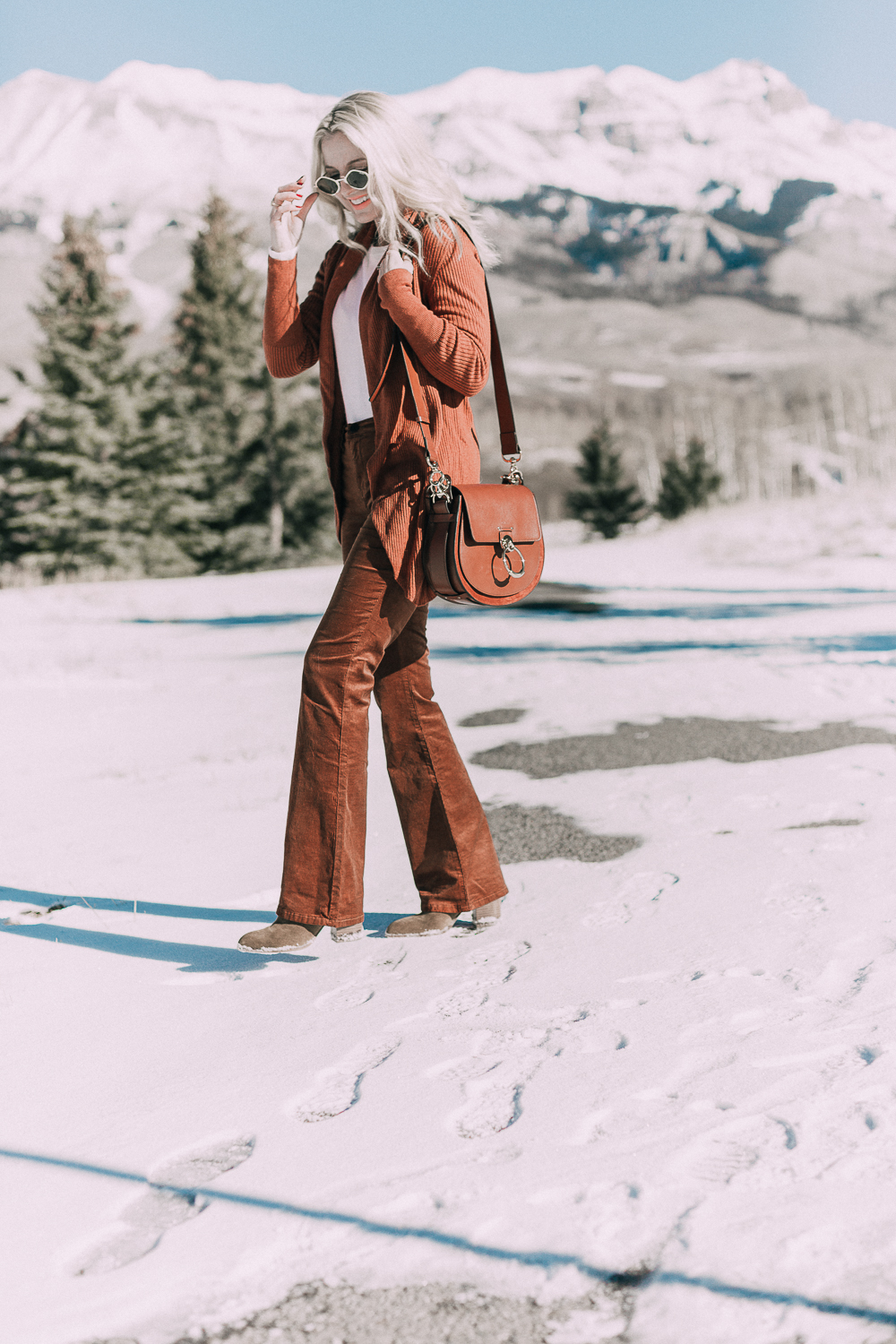 Corduroy Pants by Blank NYC paired with a Leith circle cardigan in this monochromatic rust look on fashion blogger over 40 Erin Busbee of Busbee Style in Telluride, Colorado paired with Chloe Tess Bag medium size