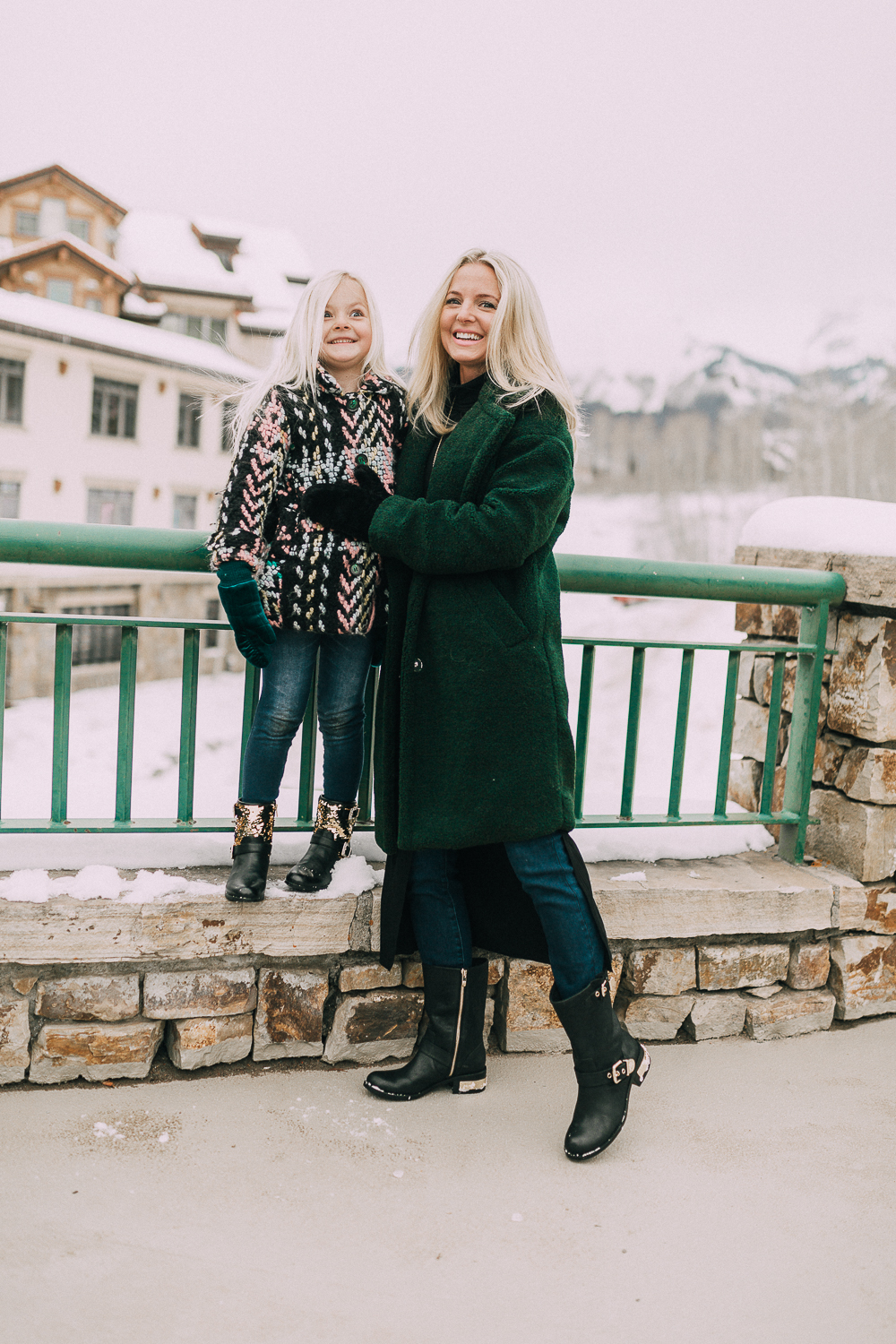 Moto Boots matching mommy and me black and gold moto boots by Vince Camuto on blonde woman and blonde daughter in snow