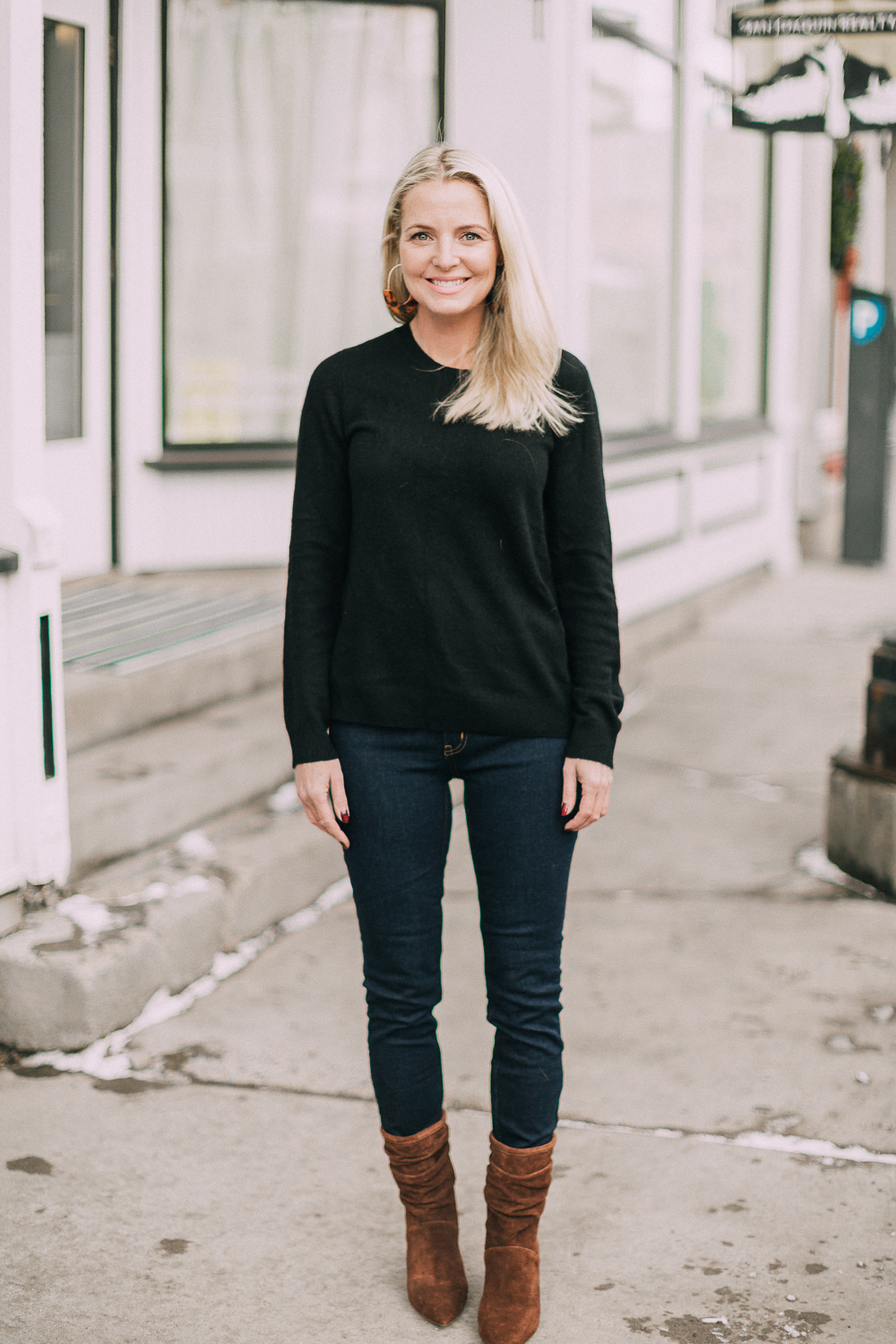 wardrobe staples your closet needs including a black cashmere crewneck sweater and high rise dark wash skinny jeans both from Walmart