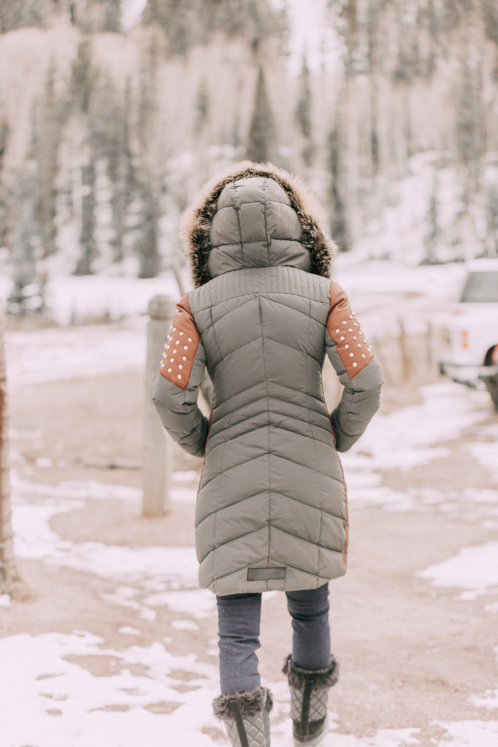 best winter coats on Fashion blogger Erin Busbee of BusbeeStyle.com wearing a Nicole Bensiti Puffer Coat in Green and Brown in Telluride, Colorado