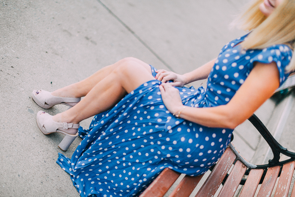 blonde fashion blogger sitting wearing nude vince camuto javasan sandals and tularosa maxi dress