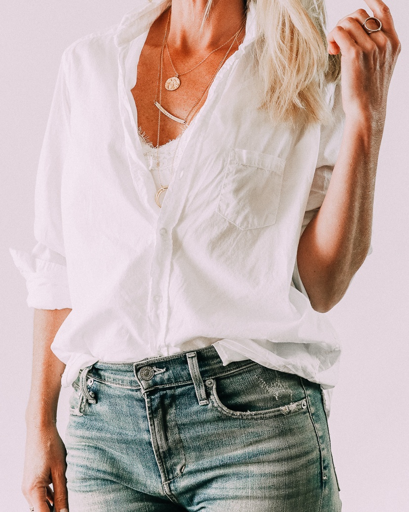 Fundamentals of styling white button down shirt featuring fashion blogger over 40 and wardrobe styling expert Erin Busbee wearing white button down shirt with distressed skinny jeans