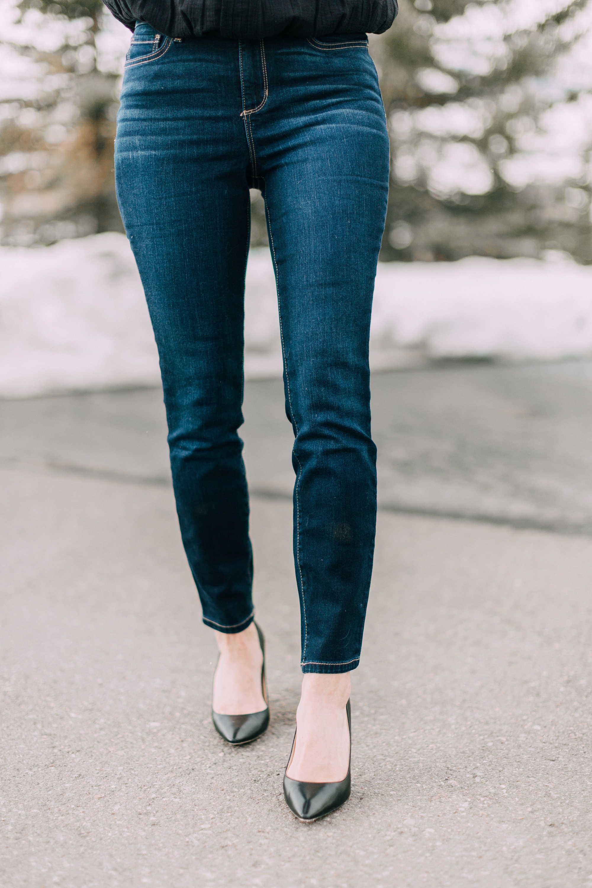 Fashion blogger Erin Busbee wearing dark wash skinny jeans from the new Sofia Vergara line at Walmart with black pumps