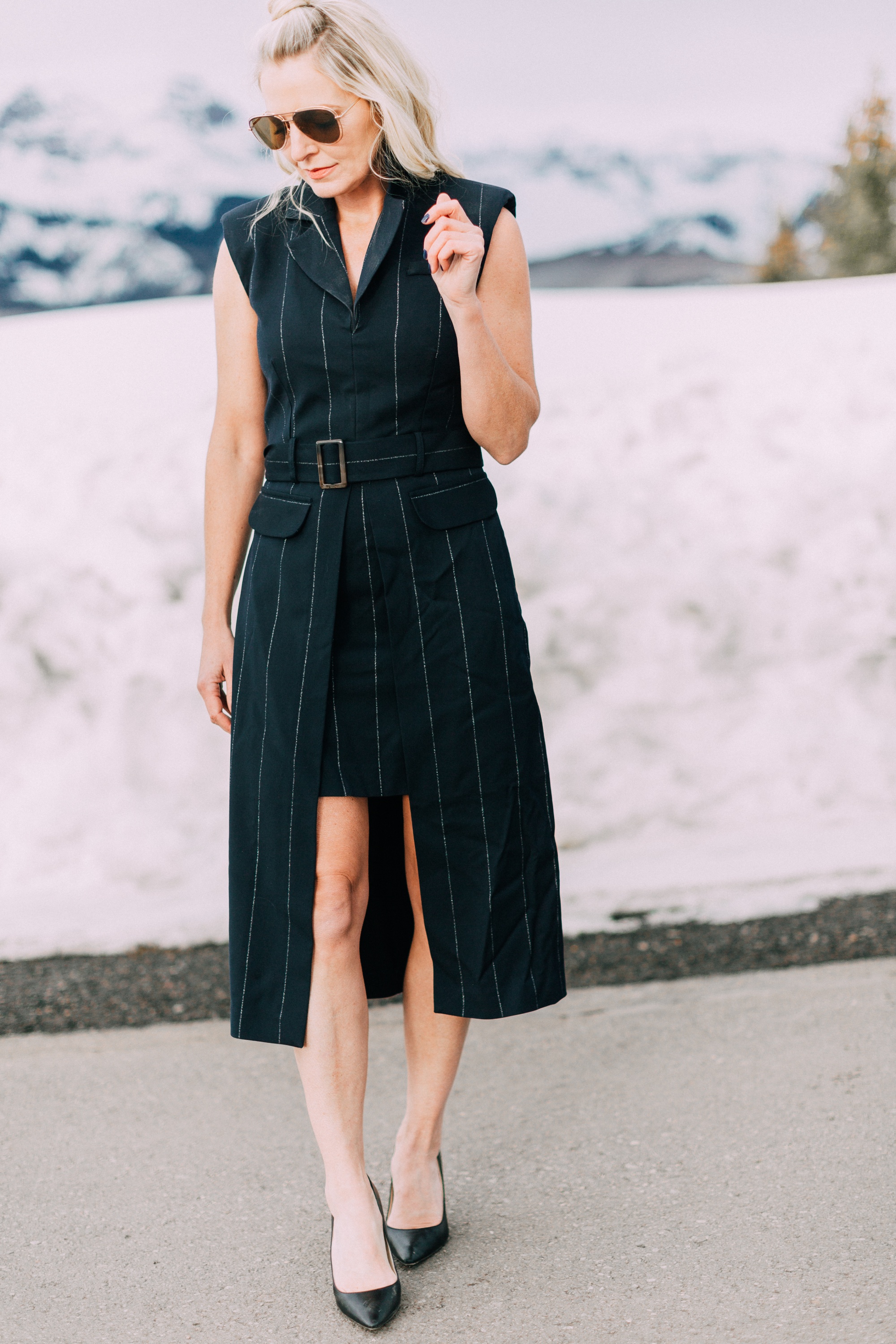 Spring Office Dress, fashion blogger Erin Busbee of BusbeeStyle.com wearing a navy pinstripe dress from Asos with black Jimmy Choo pumps in Telluride, Colorado, talking about dresses for the office