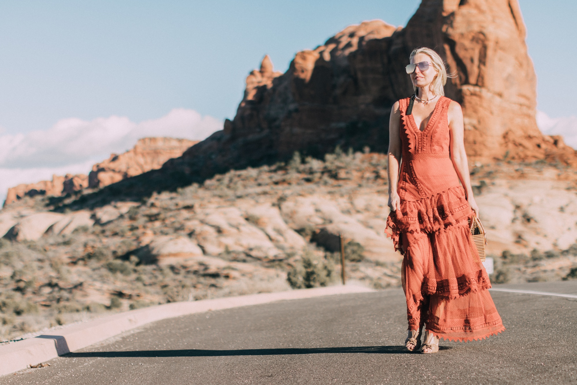 Spring Handbags, Fashion blogger Erin Busbee of BusbeeStyle.com wearing an ornage House of Harlow dress from Revolve with Vince Camuto bamboo basket bag in Moab, Utah