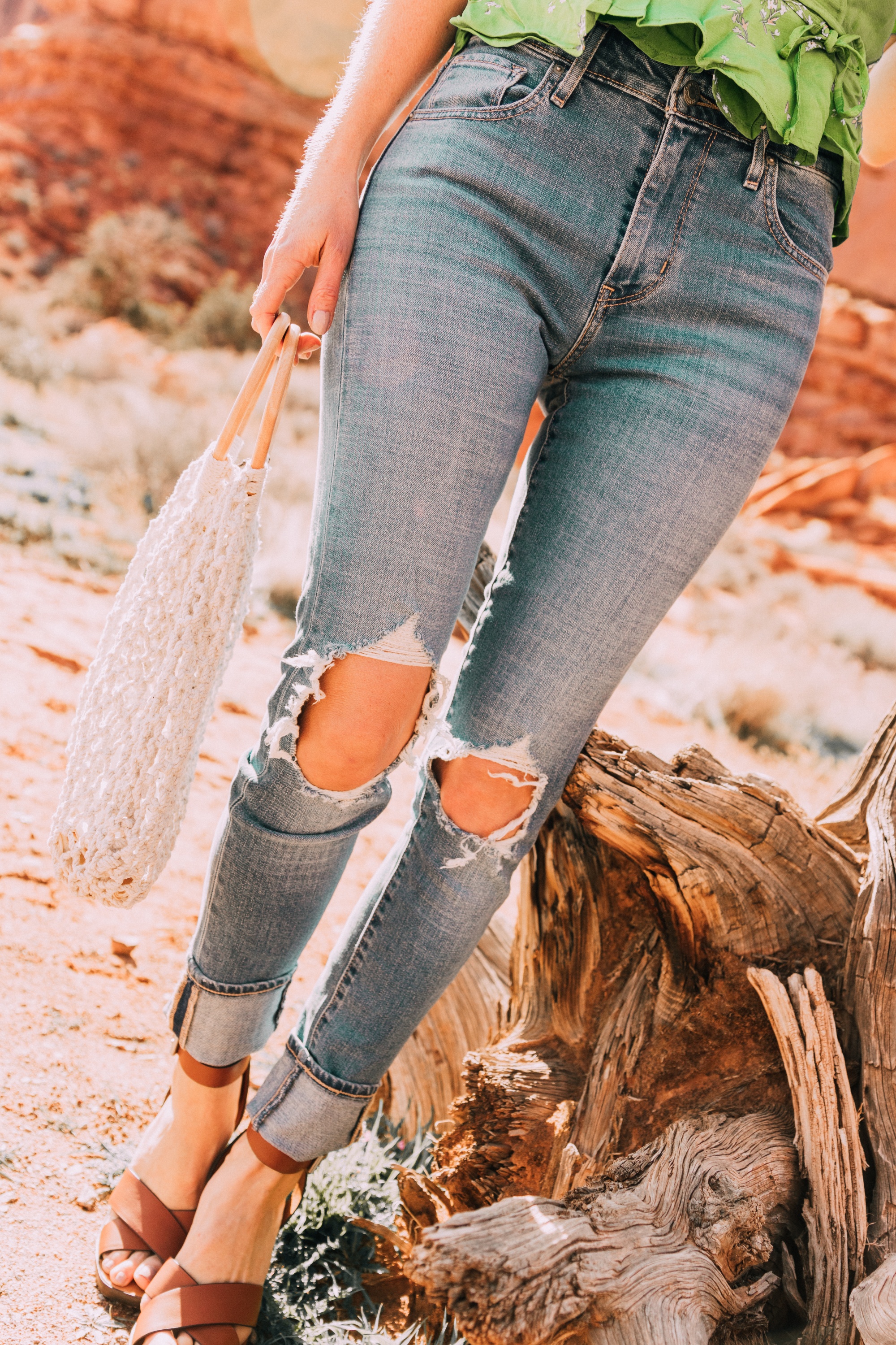 Good For The Globe, Fashion blogger Erin Busbee of BusbeeStyle.com featuring Levi 721 skinny jeans, a green floral Faithfull The Brand top, Kayu rope bag from Bloomingdale's in Moab, Utah