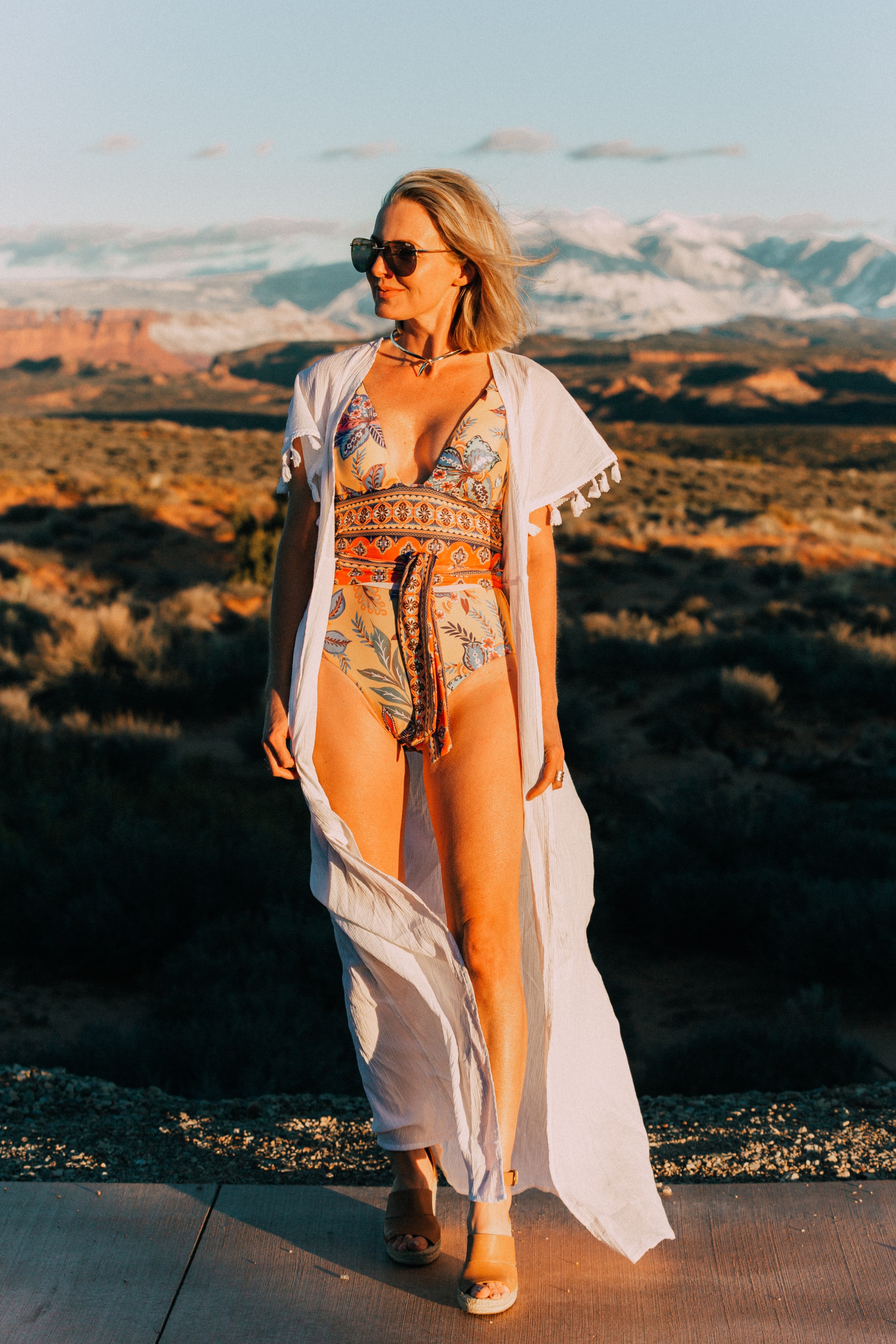 Full Coverage one piece paisley swimsuit by becca for women over 40 years old with Eddie Bargo choker necklace, Treasure & Bond espadrille sandals, and a white tassel kimono from Asos in Moab, Utah