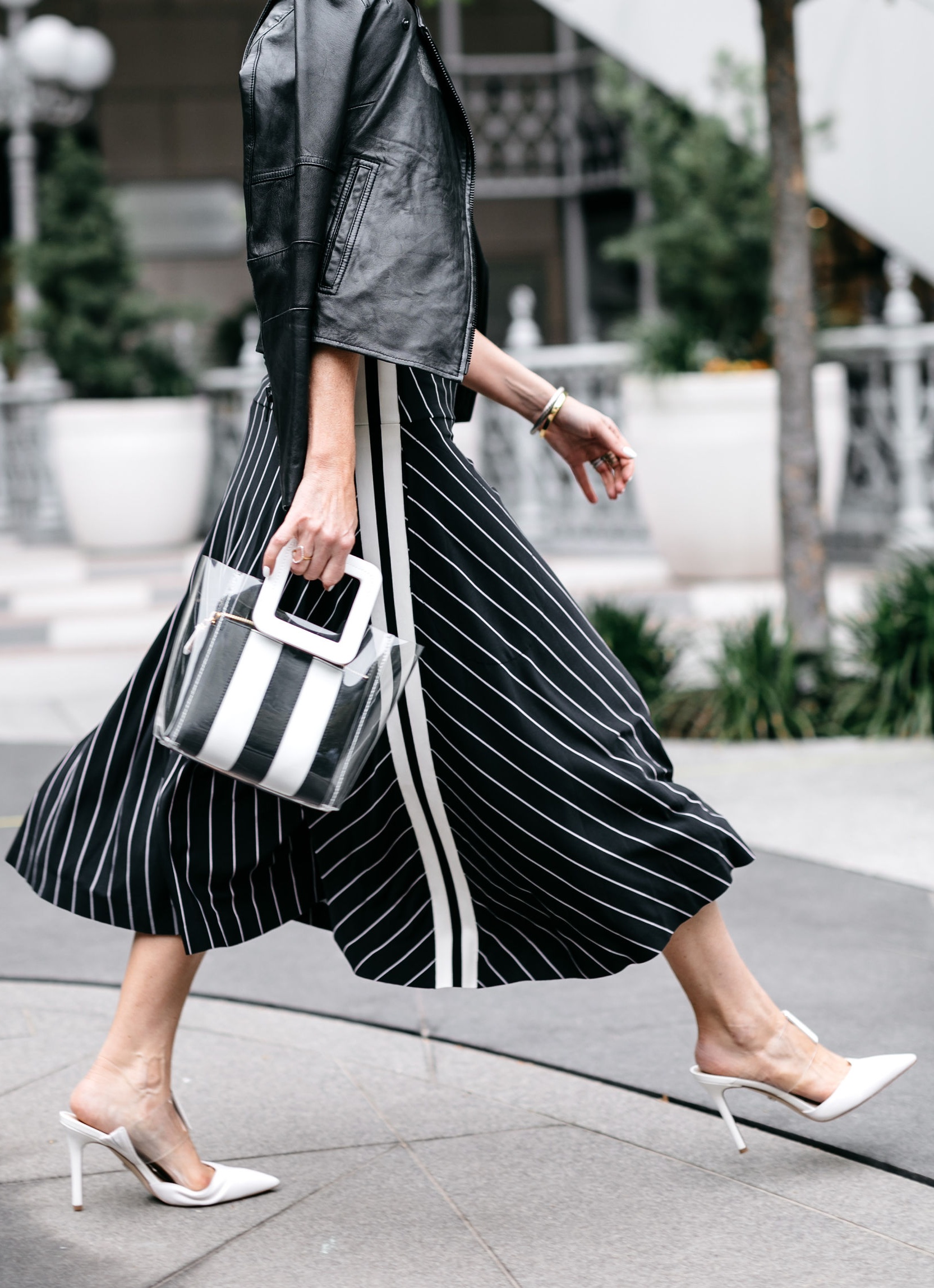 How To Mix Prints, Fashion blogger Erin Busbee of BusbeeStyle.com wearing a striped Norma Kamali skirt, white Sam Edelman Hope Pumps, white LNA tee, black and white striped Staud shirley tote, and Joie black leather jacket in Dallas, Texas at the rewardStyle Conference