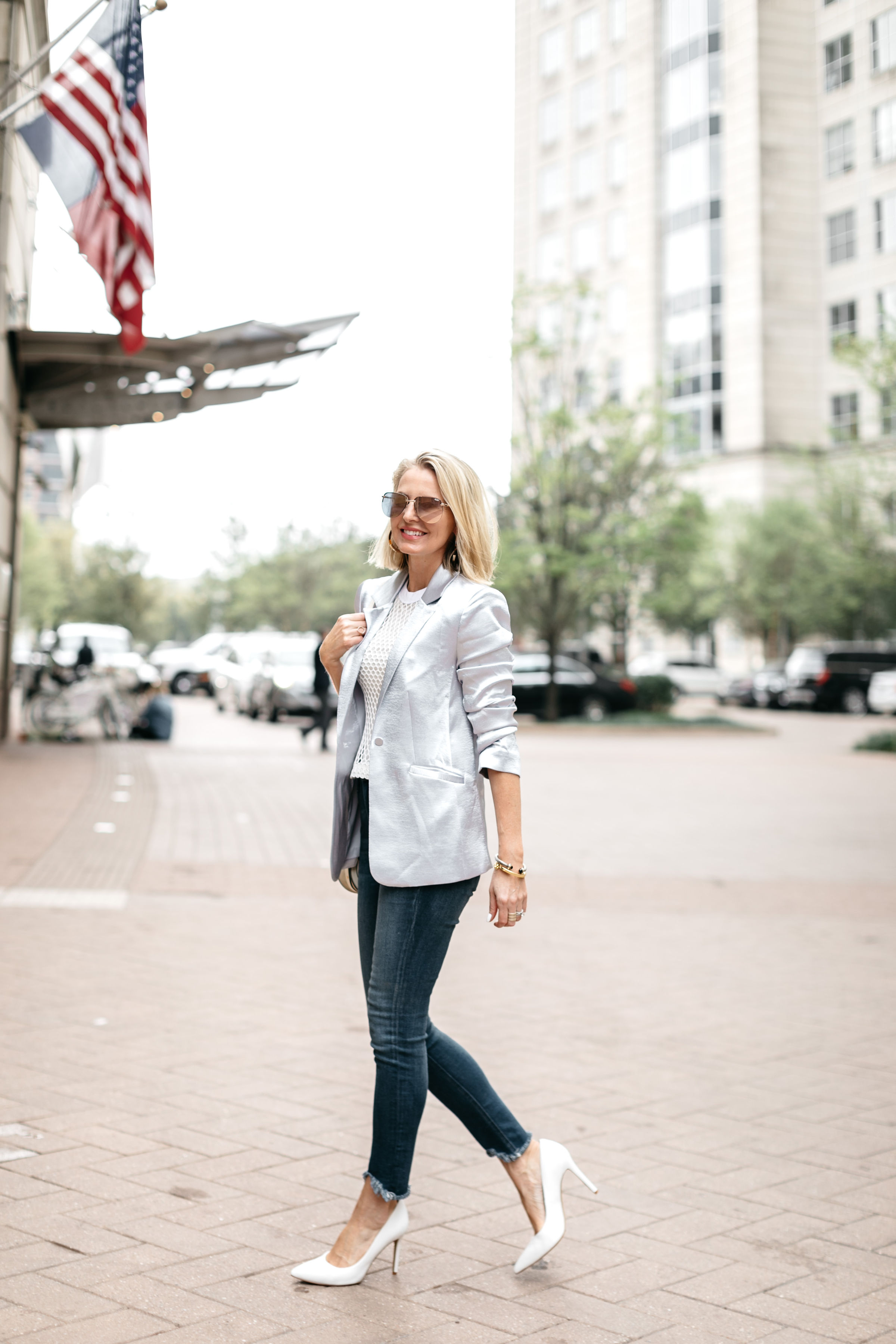 fashion blogger showing how to elevate a casual outfit with the cinq a sept kylie jacket and sam edelman white leather hazel pumps at the rewardstyle conference in dallas