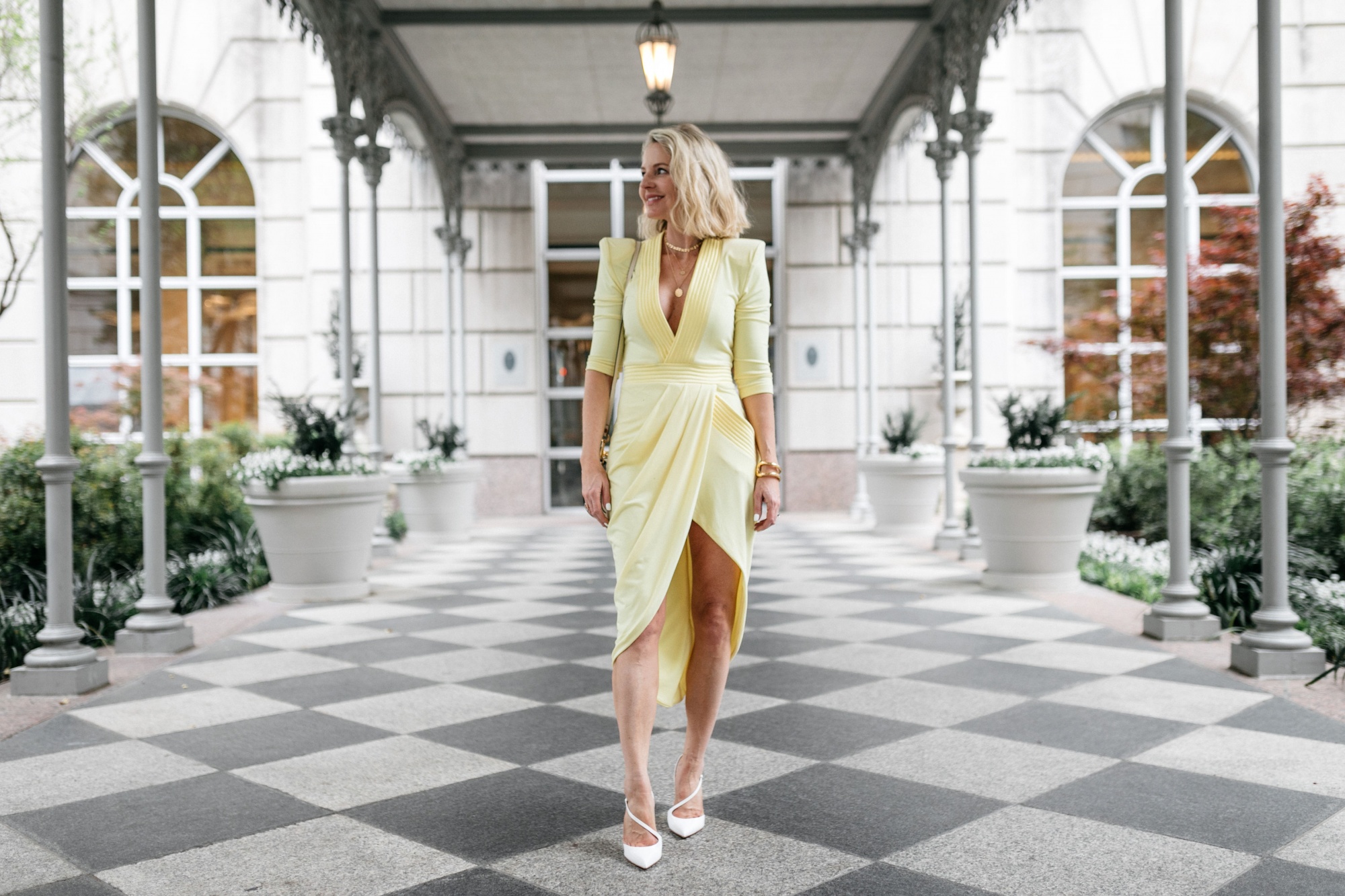 yellow color trend, fashion blogger Erin Busbee at the Reward Style conference in Dallas, Texas wearing a yellow statement dress by Zhivago