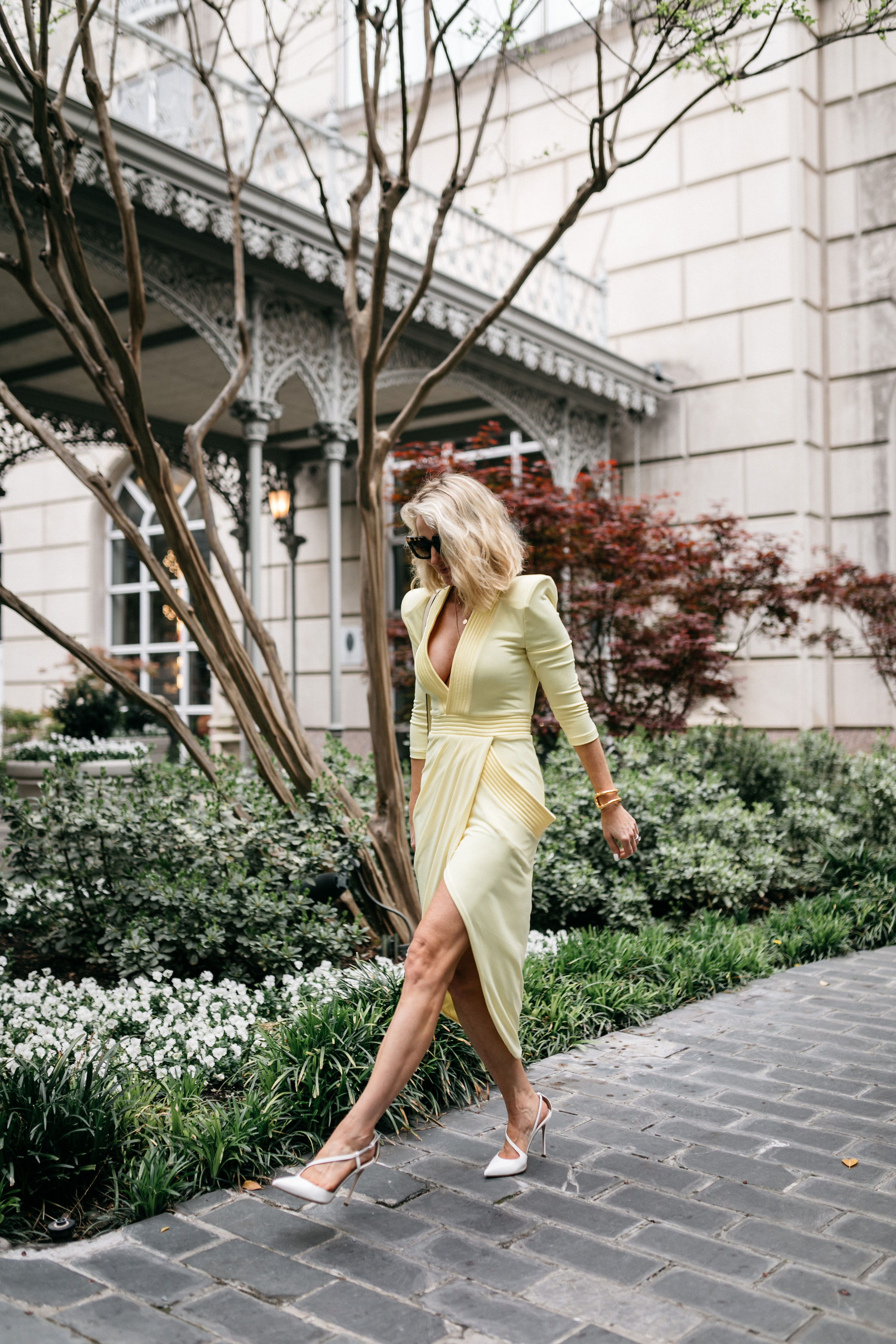 Reward Style Conference 2019, Fashion blogger Erin Busbee of BusbeeStyle.com wearing a yellow Zhivago dress and Sergio Rossi pumps for a cocktail party in Dallas, Texas
