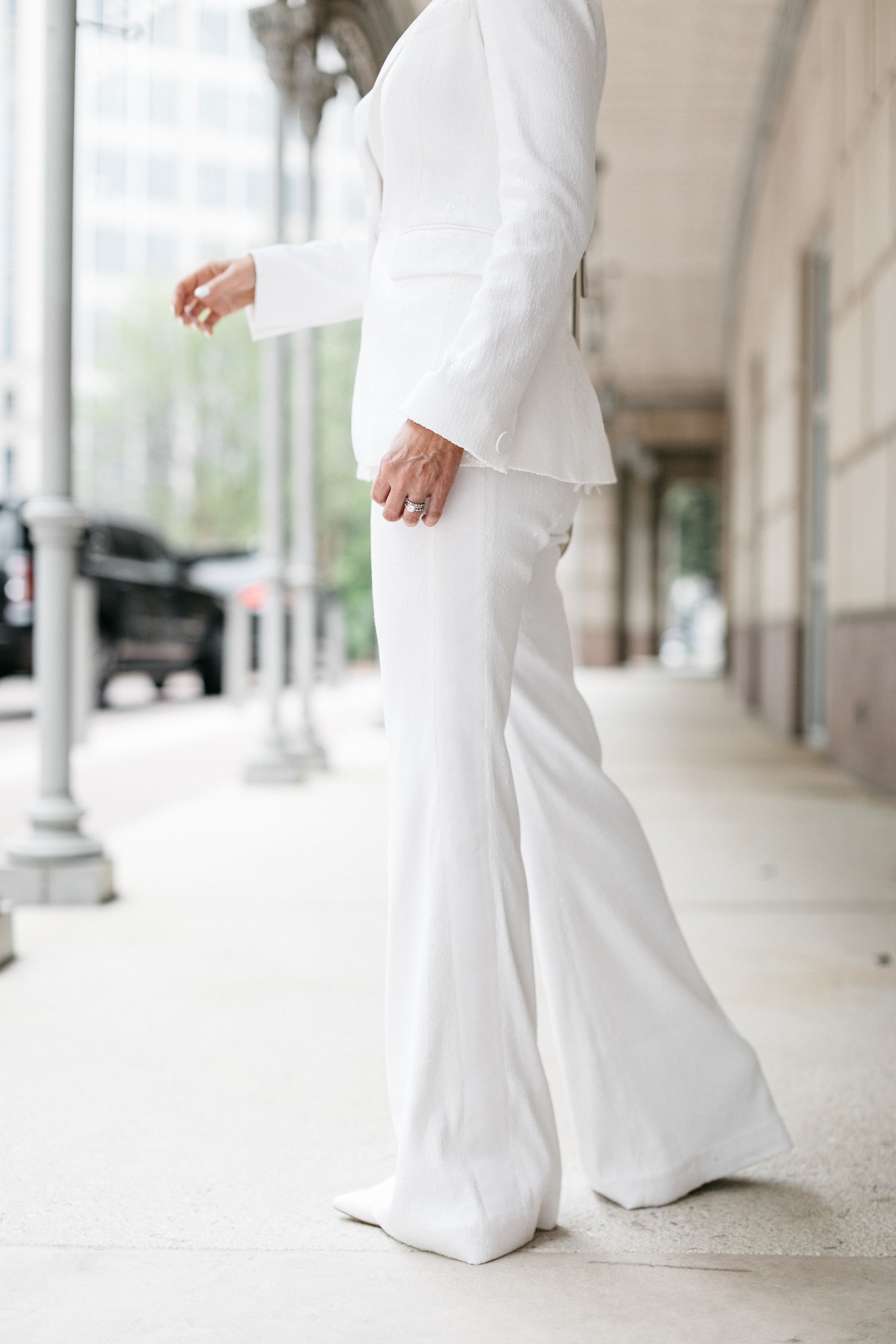 Perfect White Suit, Fashion blogger Erin Busbee of BusbeeStyle.com wearing a matching white sequin blazer and wide leg pants by Rachel Zoe, white pointed toe pumps, and a white chloe nile bag in Dallas, Texas