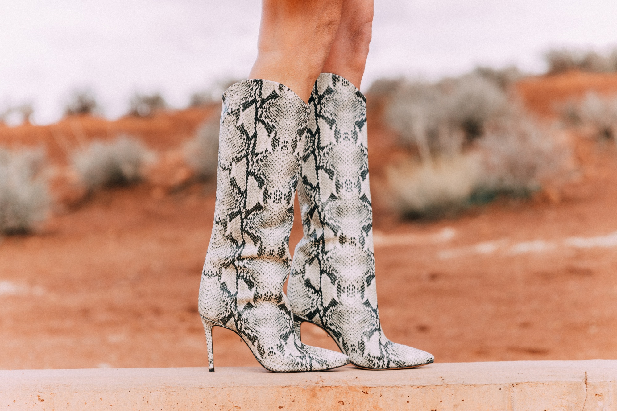 What To Wear To A Spring Wedding, Fashion blogger Erin Busbee of BusbeeStyle.com Schultz python print boots in Moab, Utah