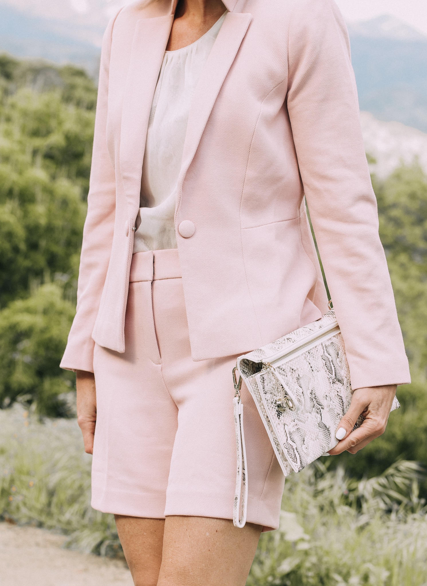 Spring Office Outfits, Fashion blogger Erin Busbee of BusbeeStyle.com wearing matching pink shorts and blazer with pink snake print heels and clutch from White House Black Market in Sequoia National Park