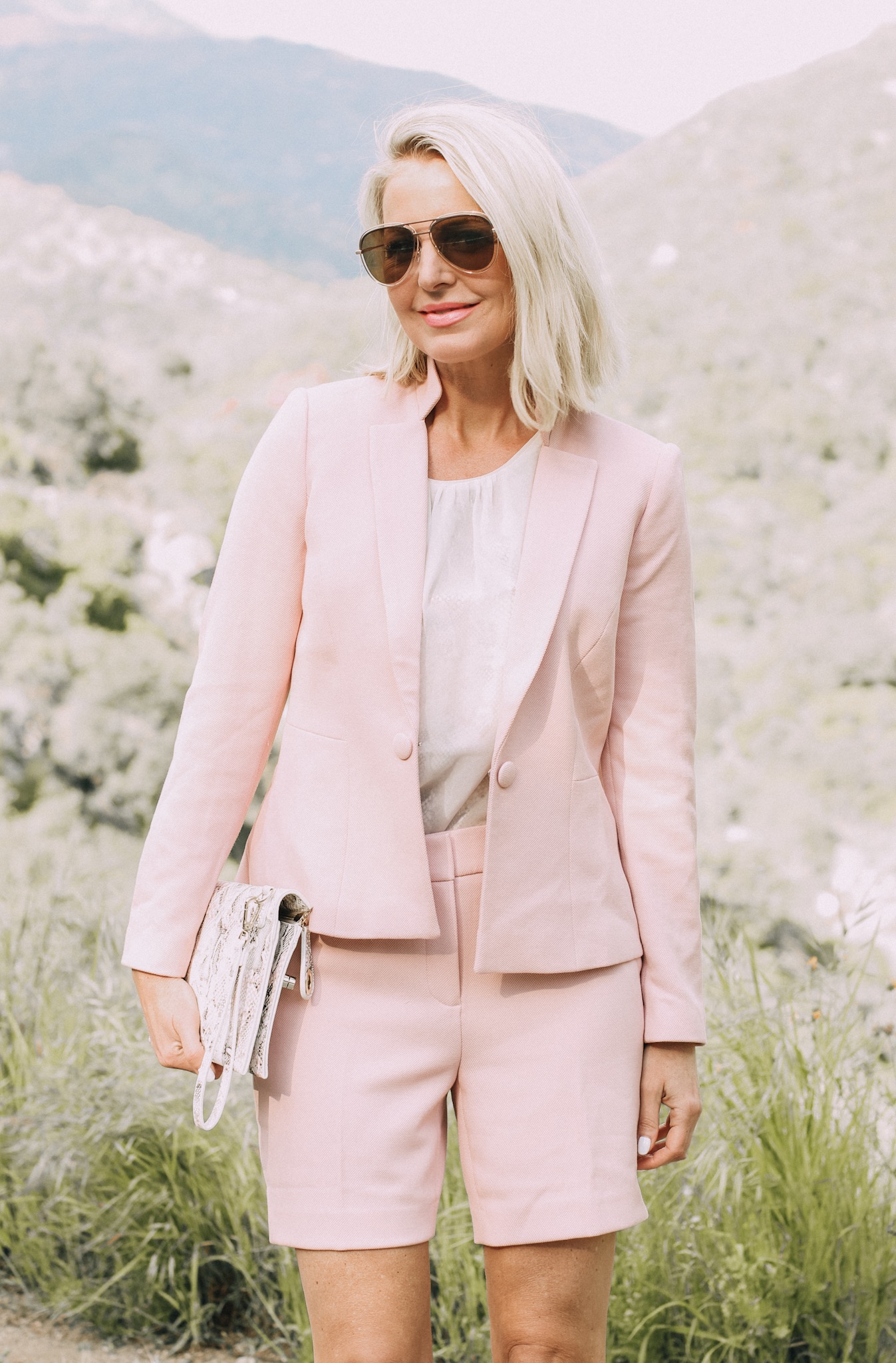 Spring Office Outfits, Fashion blogger Erin Busbee of BusbeeStyle.com wearing matching pink shorts and blazer with pink snake print heels and clutch from White House Black Market in Sequoia National Park