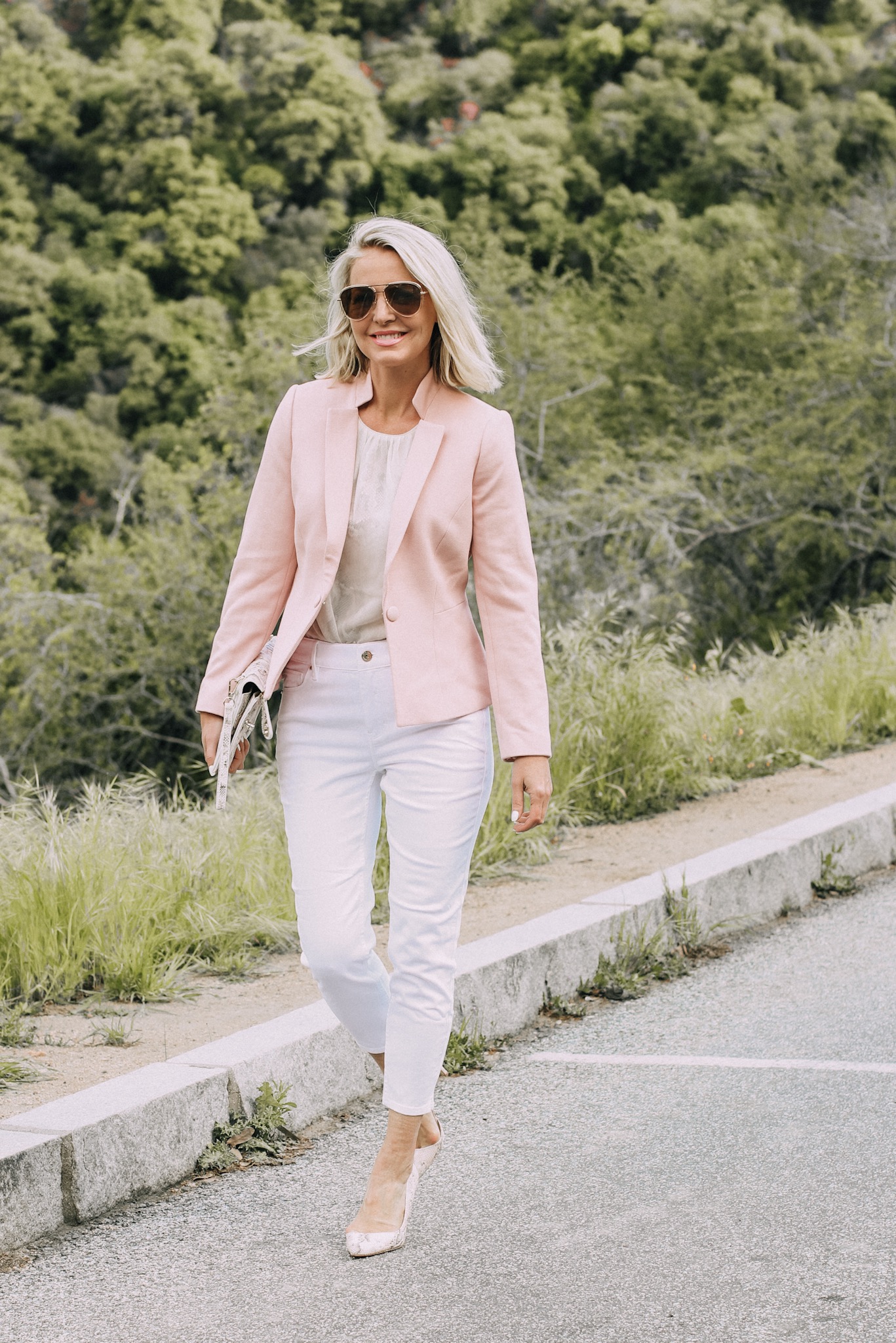 Spring Office Outfits, Fashion blogger Erin Busbee of BusbeeStyle.com wearing a blazer with a snake print shell and white cropped jeans, with pink snake print heels and clutch from White House Black Market in Sequoia National Park