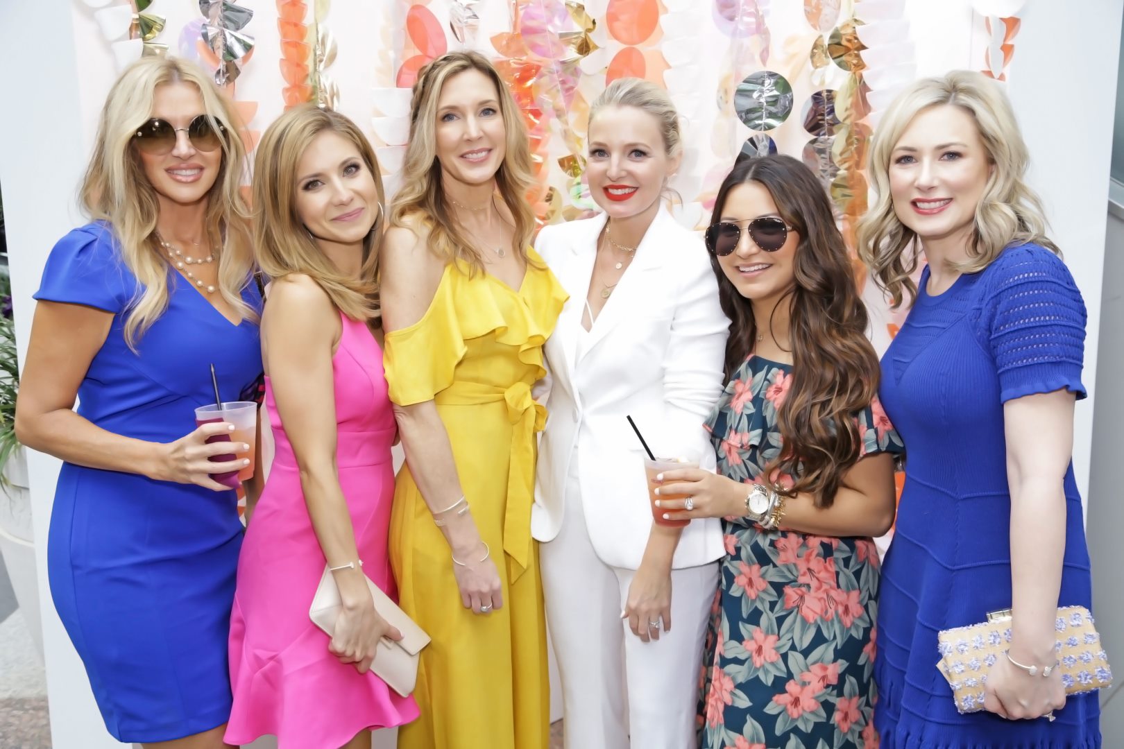 Reward Style Conference 2019, Fashion blogger erin busbee of busbeestyle.com standing with the US YouTube bloggers at a cocktail party in Dallas, Texas