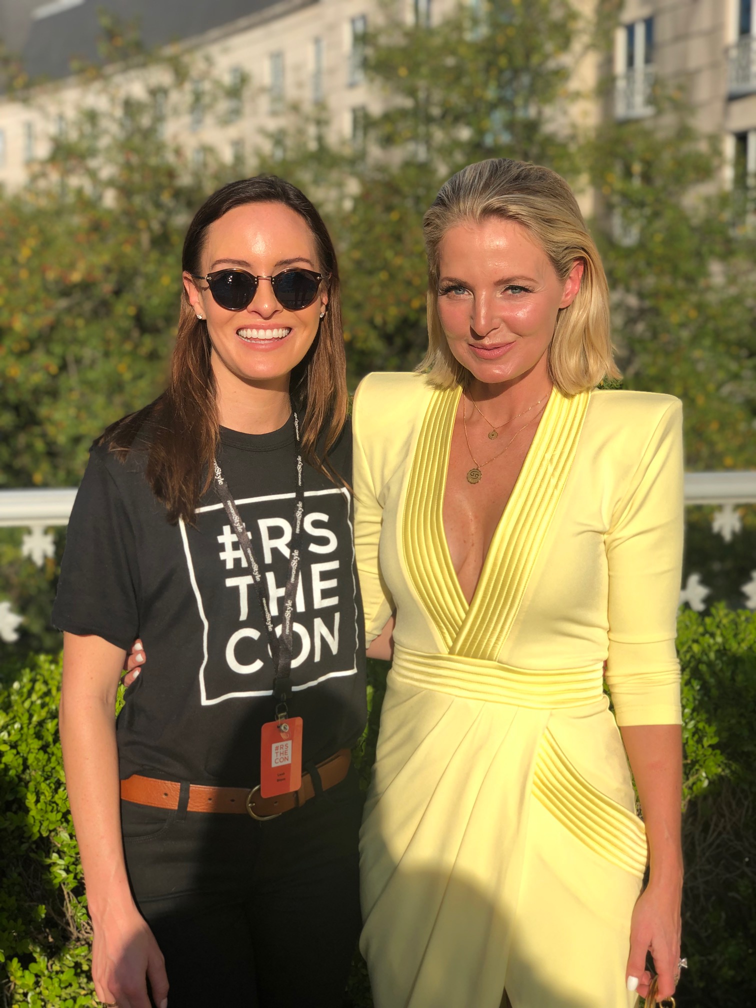 Reward Style Conference 2019, Fashion blogger Erin Busbee of BusbeeStyle.com with Leah, her rewardstyle rep, wearing a yellow Zhivago dress at a cocktail party in Dallas, Texas