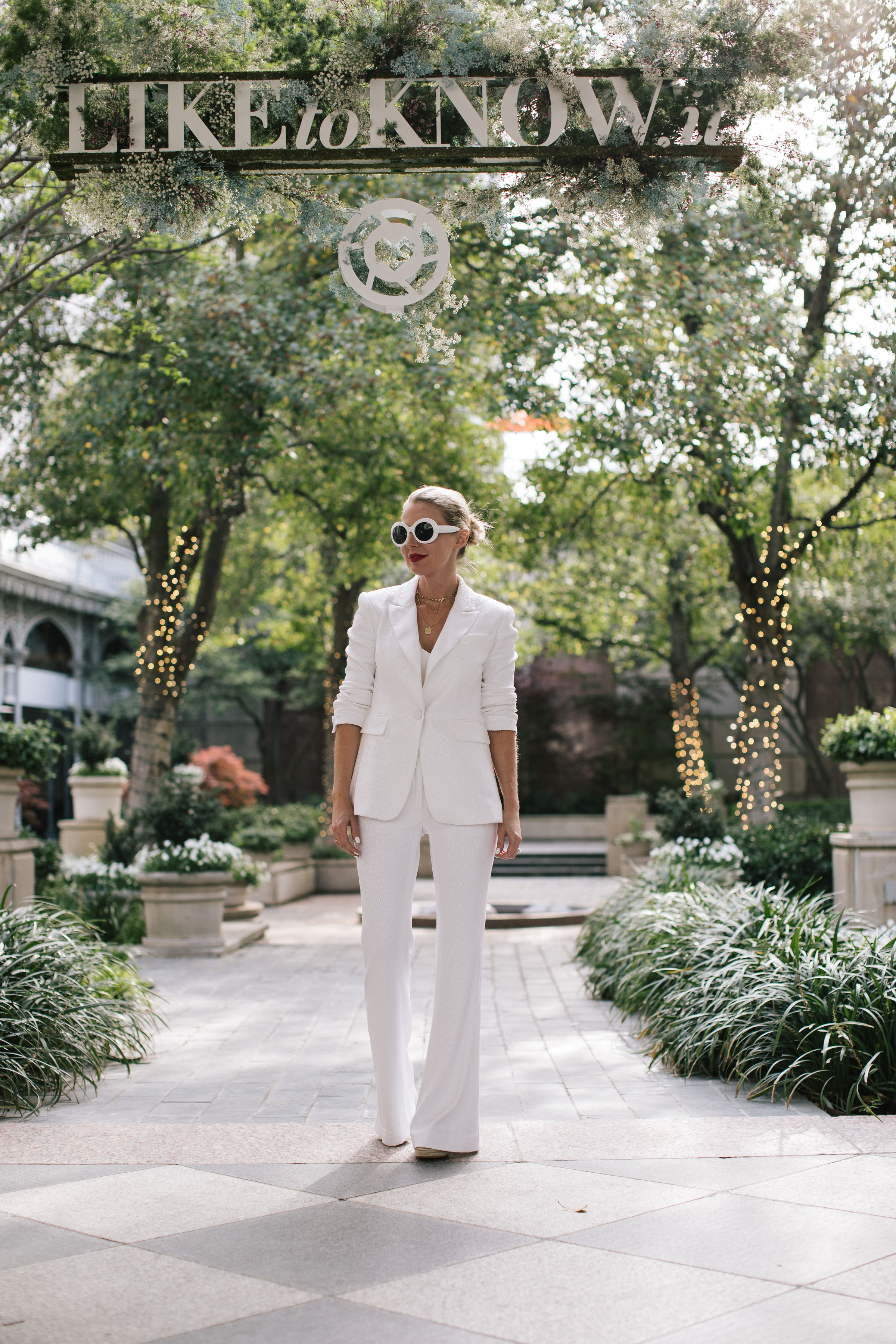 Perfect White Suit, Fashion blogger Erin Busbee of BusbeeStyle.com wearing a matching white sequin blazer and wide leg pants by Rachel Zoe, white pointed toe pumps, and a white chloe nile bag in Dallas, Texas, white monochromatic outfits