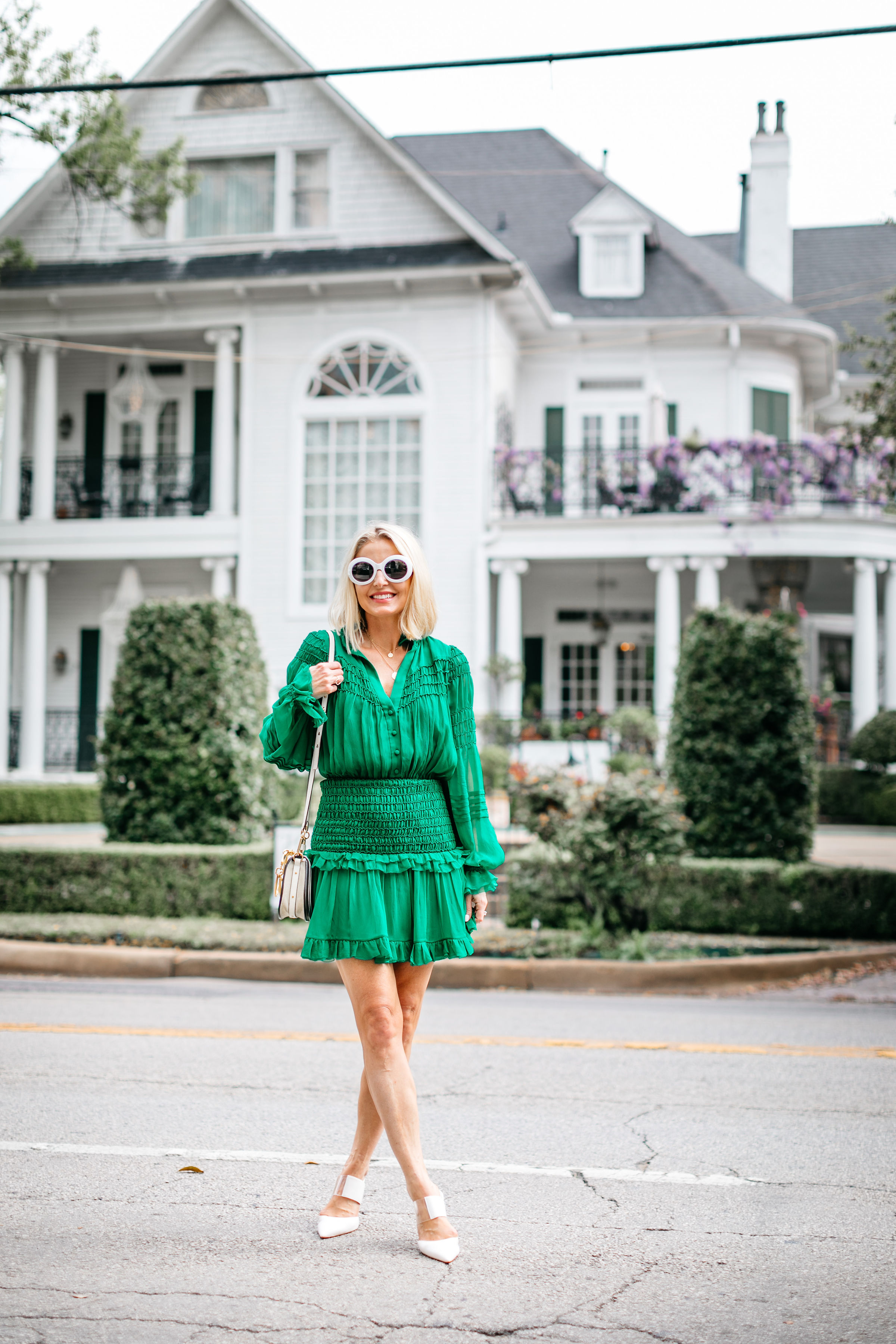fashion blogger wearing silk green ruffle dress with sam edelman hope white heels carrying chloe nile small bracelet crossbody bag