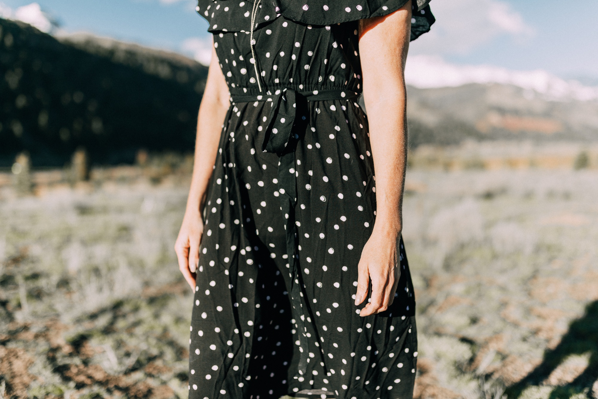 Affordable Summer Dresses, Fashion blogger Erin Busbee of BusbeeStyle.com wearing a black and white polka dot dress by A.N.A. from JCPenney with black Liz Claiborne mules in Telluride, CO