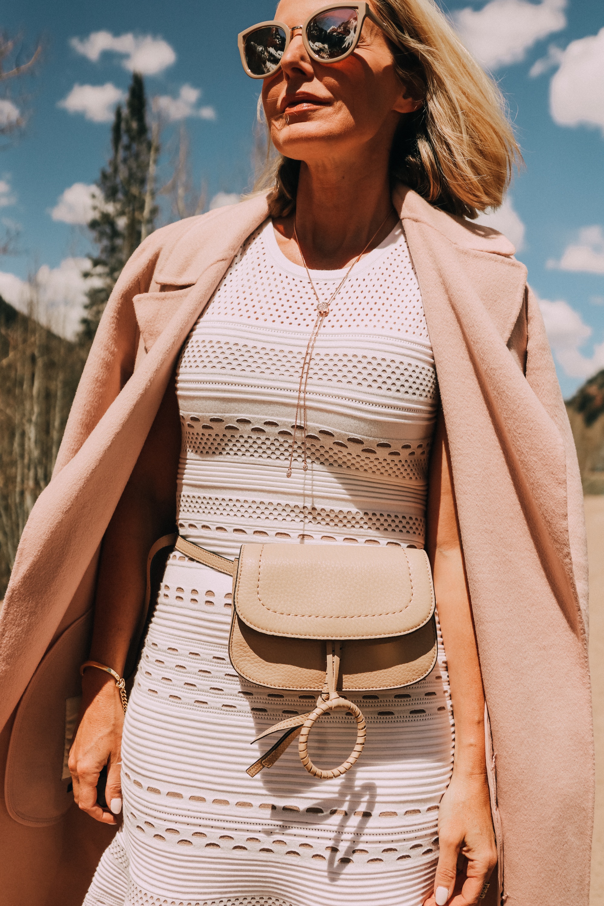 Neutral Accessories, Fashion blogger Erin Busbee of BusbeeStyle.com featuring a beige belt bag, neutral platform sandals, and a lariat necklace by Vince Camuto in Telluride, CO