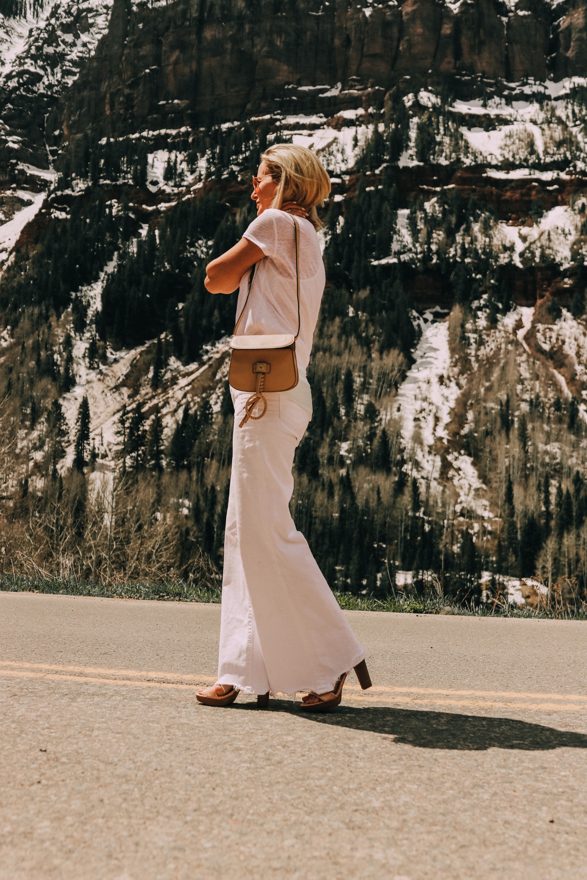 Neutral Accessories, Fashion blogger Erin Busbee of BusbeeStyle.com featuring a beige shoulder bag, neutral platform sandals, and a lariat necklace by Vince Camuto in Telluride, CO