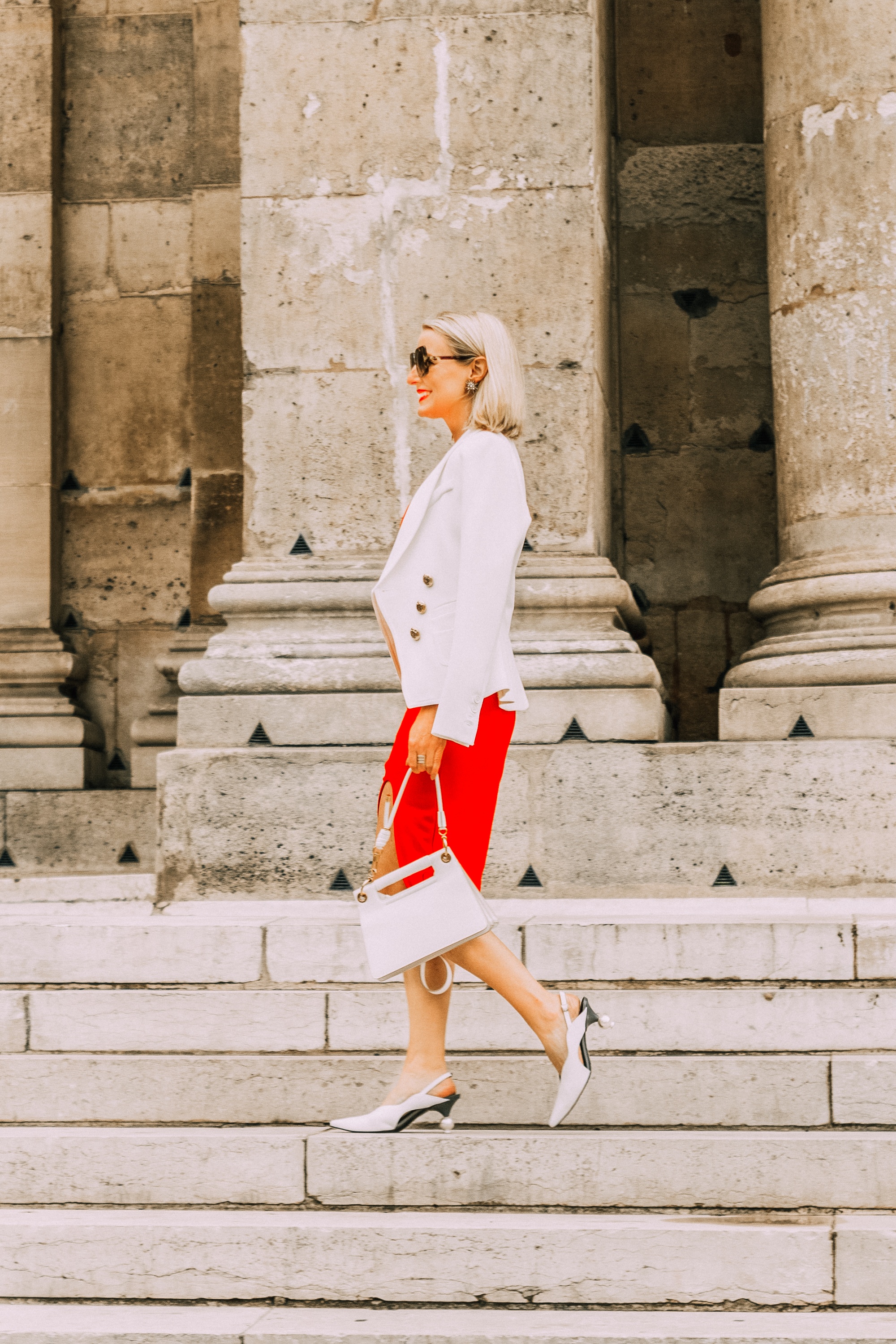 fashion blogger wearing red date night sheath dress under ivory smythe wrap blazer paired with white slingback heeled mules carrying white calfskin givenchy whip bag