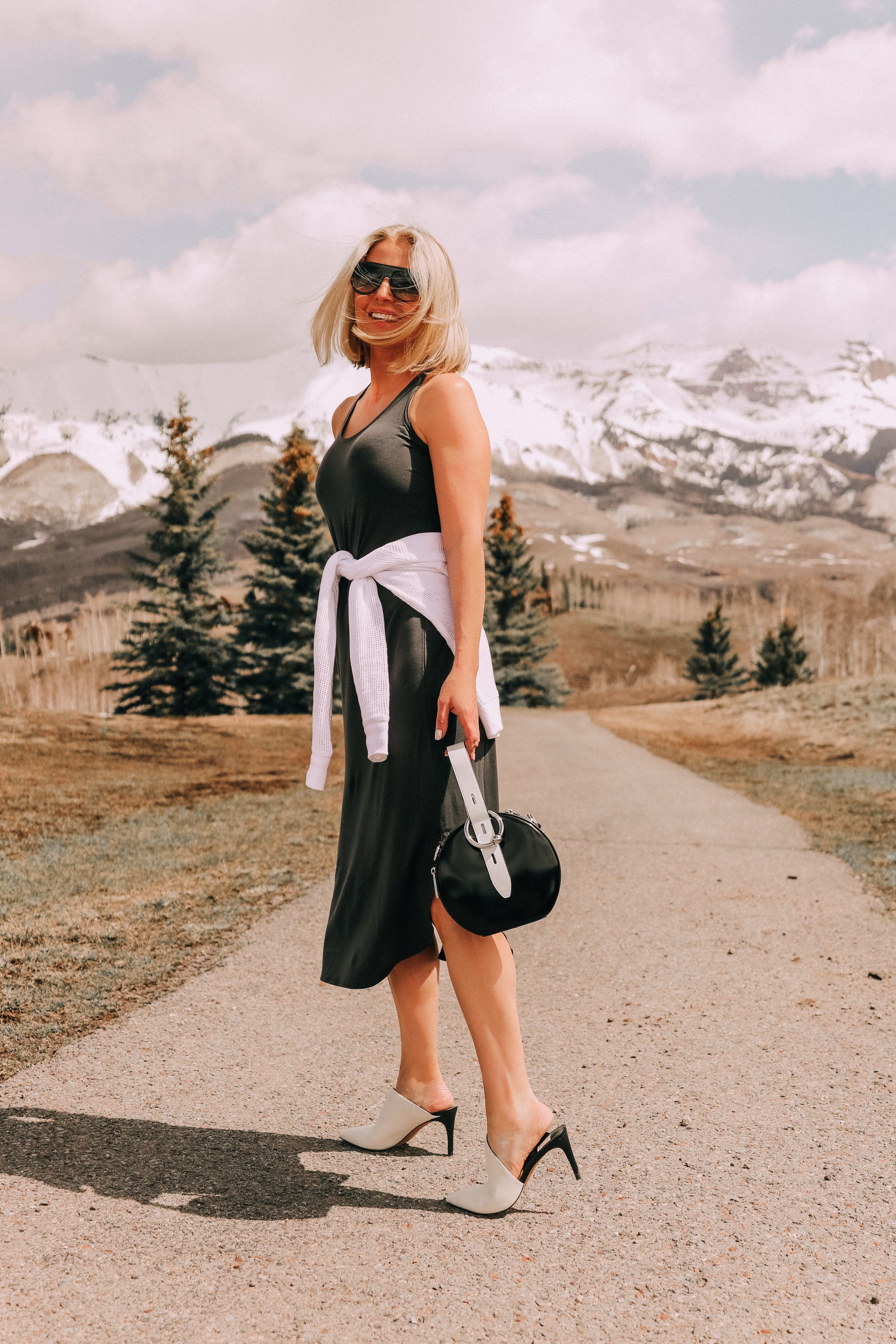 eileen fisher midi tank dress paired with dolce vita camala high-heel mules carrying rebecca minkoff kate colorblock circle bag