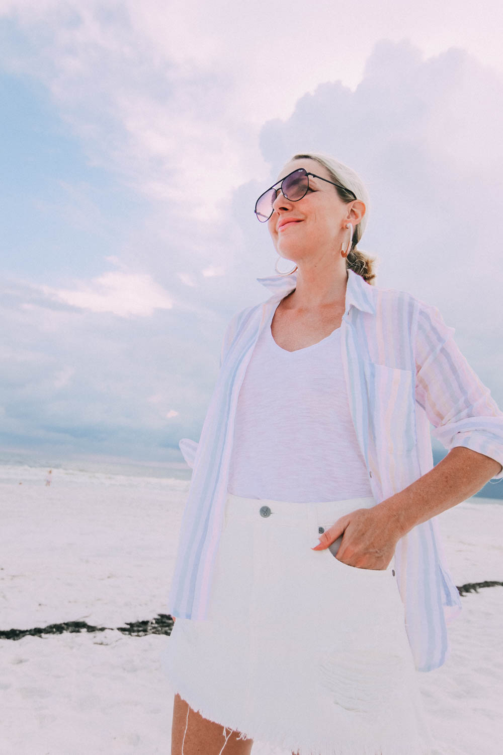 Skorts Fashion blogger busbee style wearing MinkPink white denim skirt on beach
