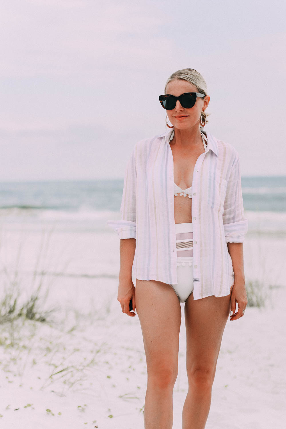 Amazon swimsuit, Fashion blogger Busbee Style wearing white bikini with pom poms from Amazon with striped Rails button down shirt on Florida beach