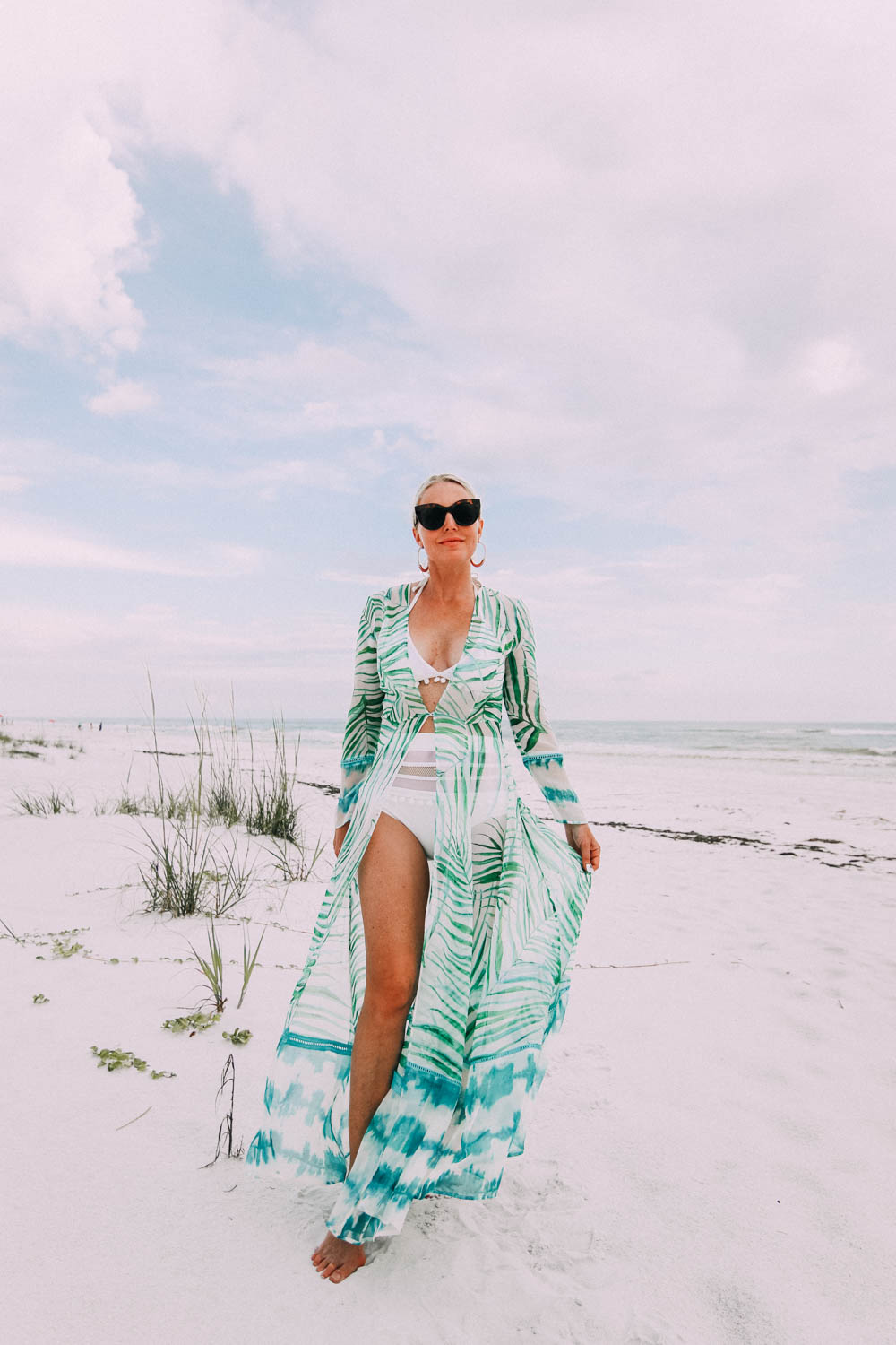 Duster Cover Up, Fashion blogger Erin Busbee of BusbeeStyle.com wearing a We Are Leone palm print duster with a white pom pom swimsuit from Amazon on the beach in Florida