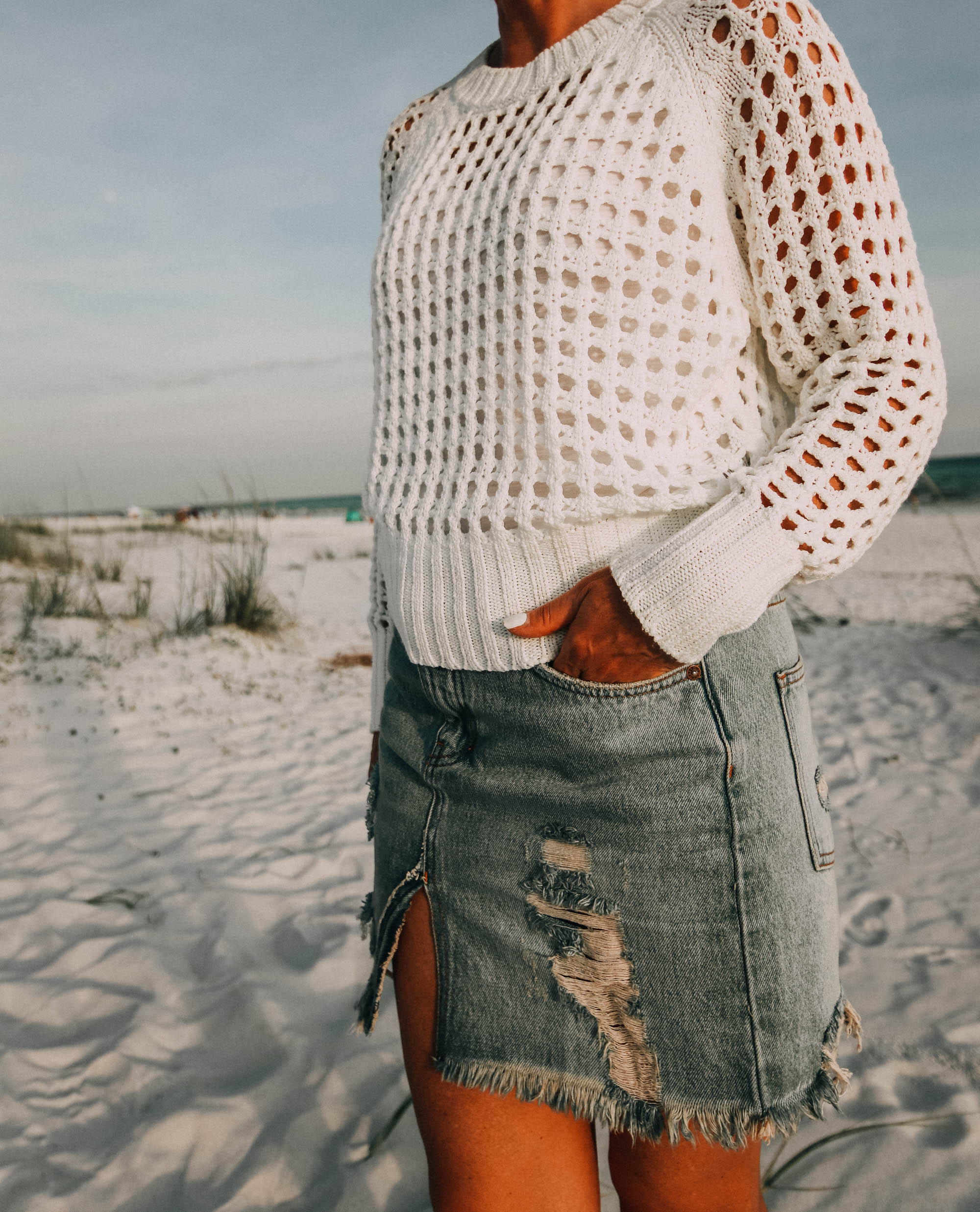 Denim Skirts, Fashion blogger Erin Busbee of BusbeeStyle.com wearing a denim skirt by Free People with a white knit sweater from Nordstrom on the beach in Florida