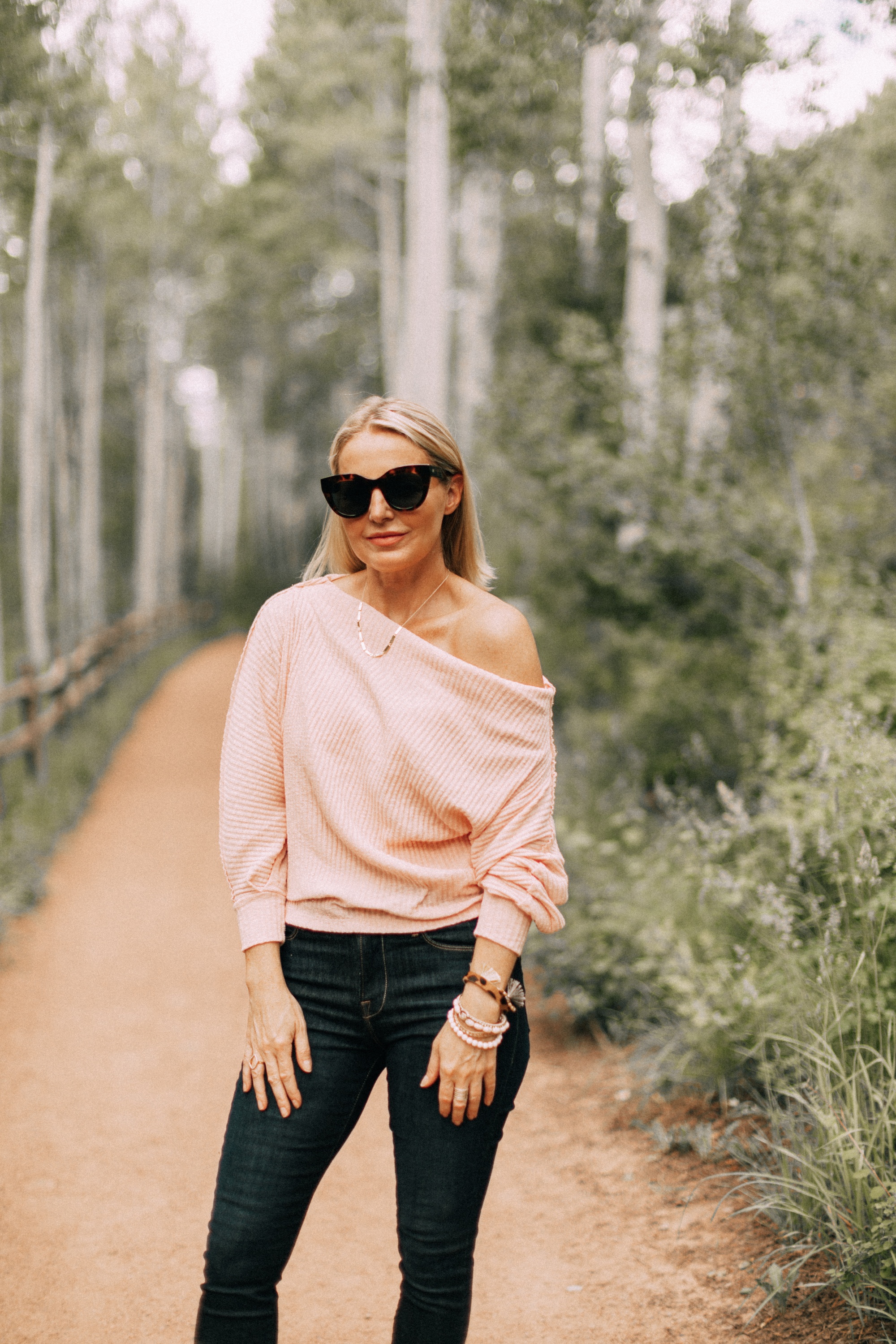 fashion blogger over 40 is sexy sophisticated off the shoulder sweater outfit, pink off the shoulder Gibson sweater top