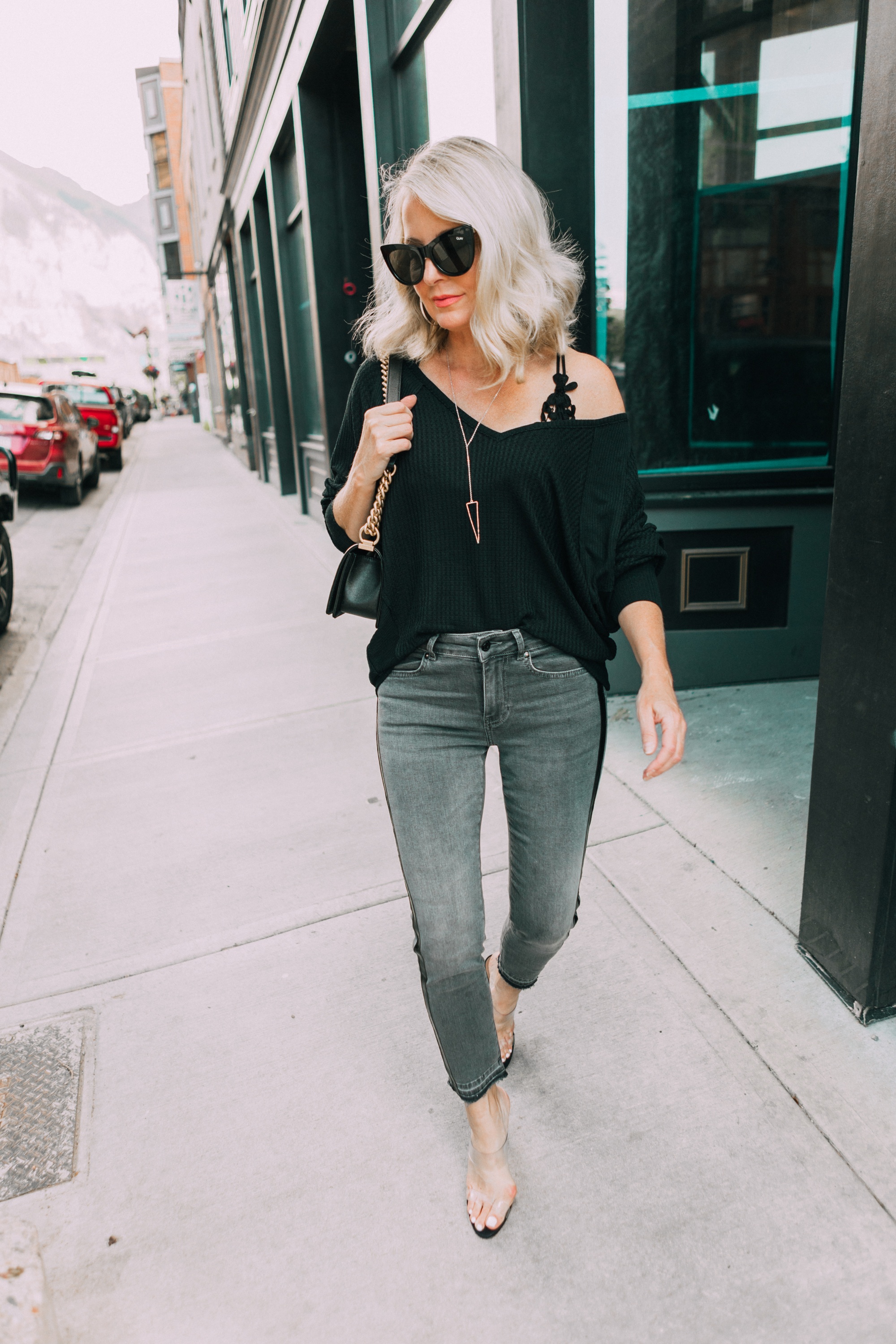 Striped Jeans, Fashion blogger Erin Busbee of BusbeeStyle.com wearing black patent striped jeans by Escada, waffle knit tee by Free People, bralette by Free People, heels by Schutz, and Chanel bag from Bloomingdale's in Telluride, CO