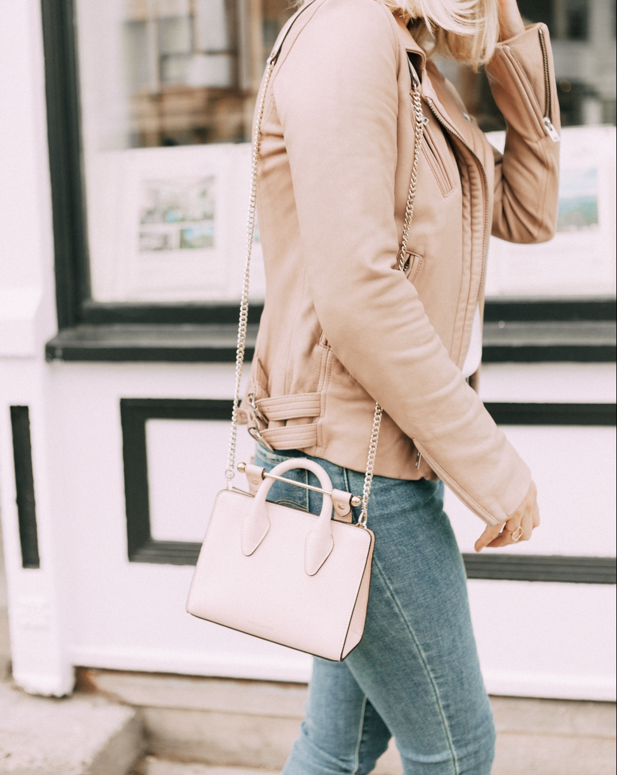 Hot Handbags, Fashion blogger Erin Busbee of BusbeeStyle.com wearing a pale pink Strathberry Nano Tote with a beige leather jacket by IRO, white lace cami, and Levi jeans in Telluride, Colorado