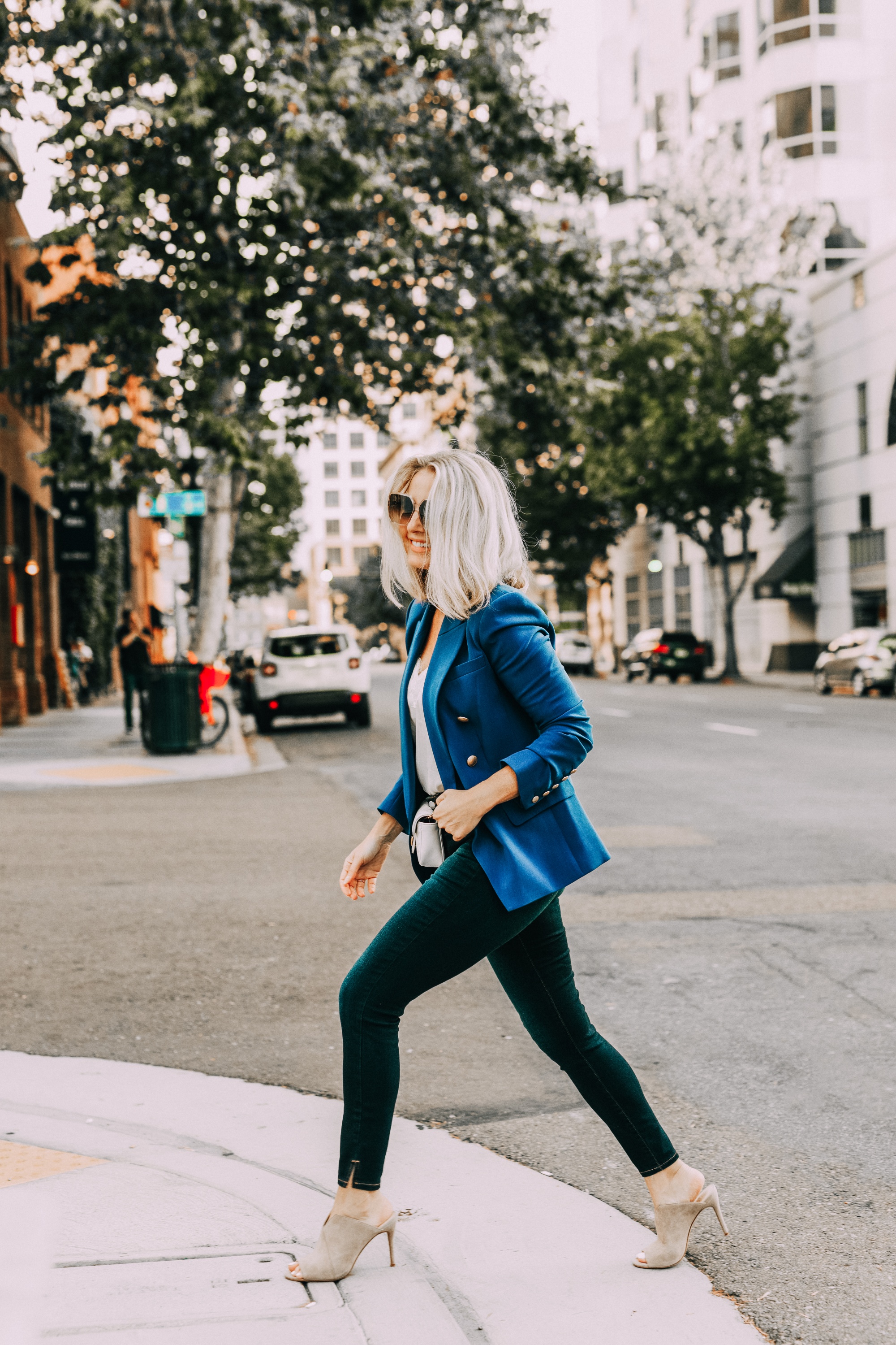 Blue Blazer, Fashion blogger Erin Busbee of BusbeeStyle.com wearing a bold blue blazer by L'AGENCE with a white cami, dark wash skinny jeans by L'AGENCE, neutral mules by Vince Camuto, and a white mini Gucci bag in San Diego, CA