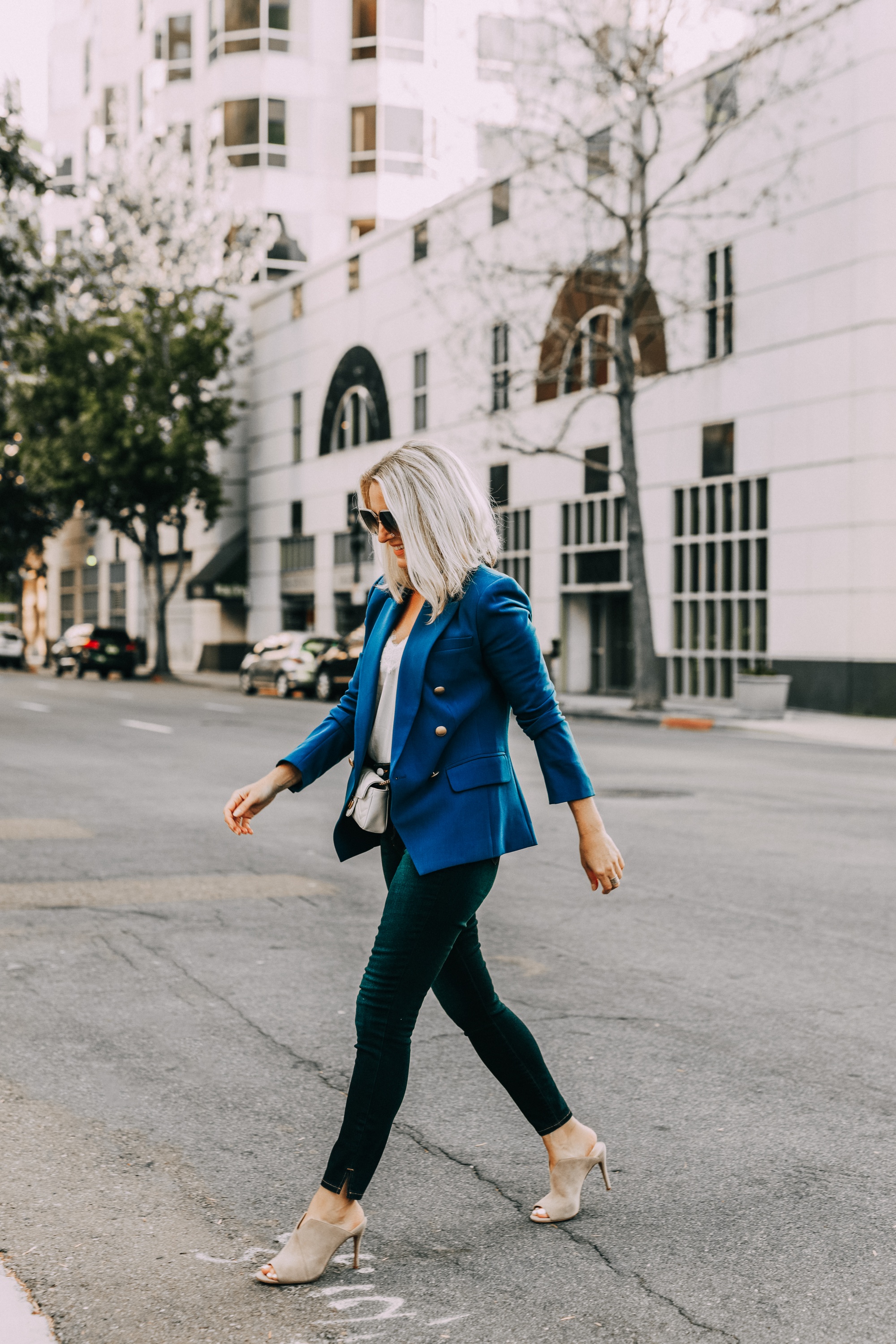 Blue Blazer, Fashion blogger Erin Busbee of BusbeeStyle.com wearing a bold blue blazer by L'AGENCE with a white cami, dark wash skinny jeans by L'AGENCE, neutral mules by Vince Camuto, and a white mini Gucci bag in San Diego, CA